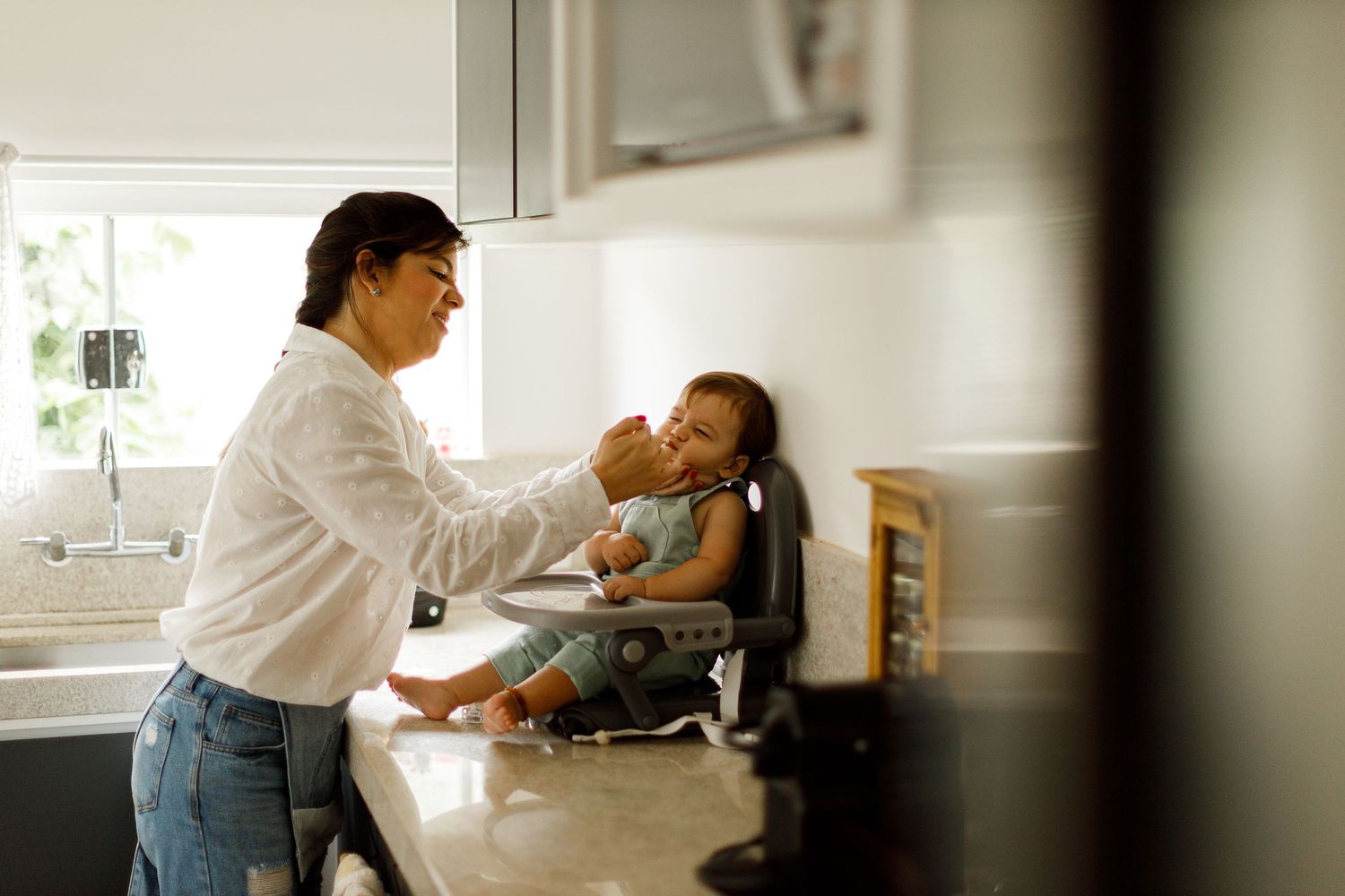 Series of candid family moments captured in a bright, sunlit room.