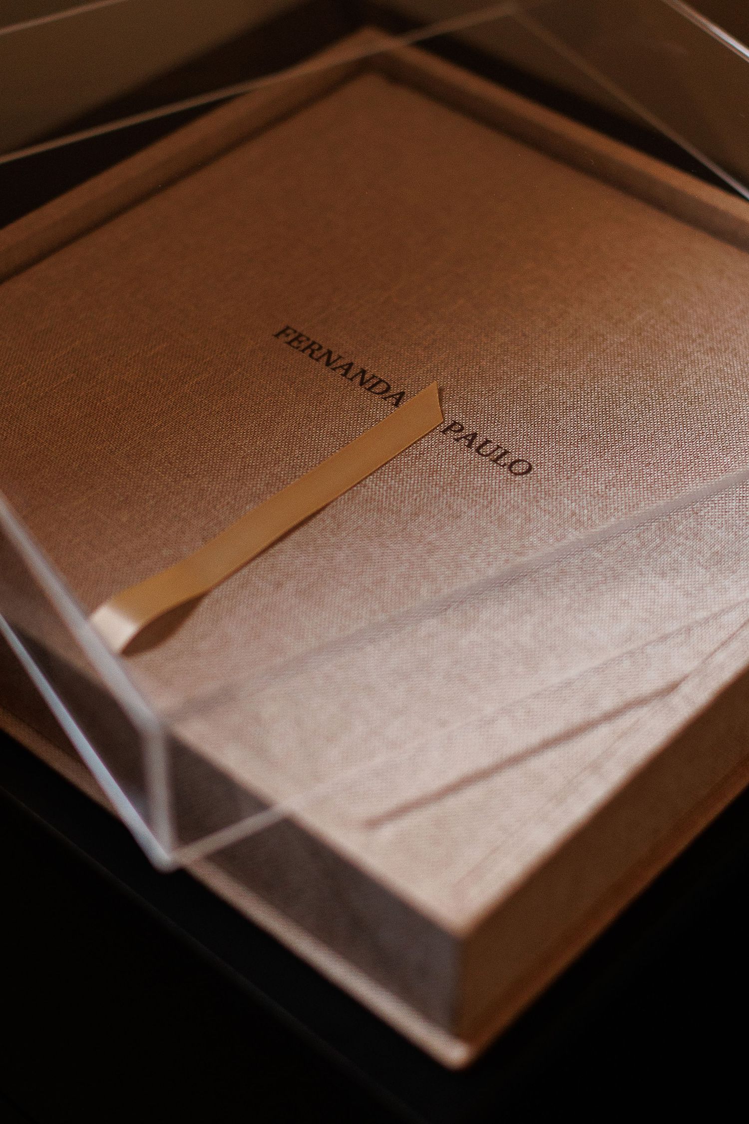 Textured paper documents with embossed text in warm lighting.