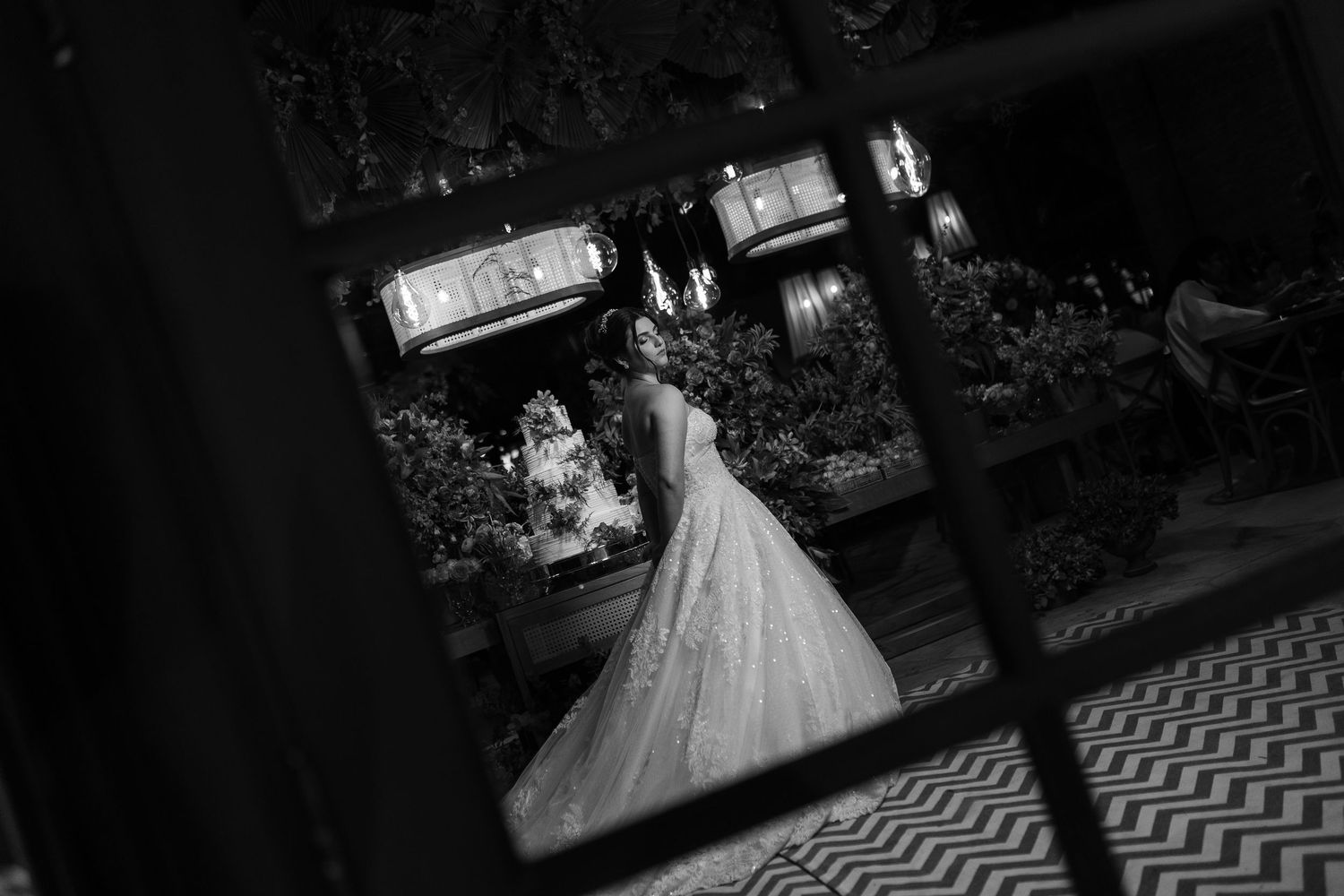 Black and white wedding photography with dramatic lighting and geometric patterns.