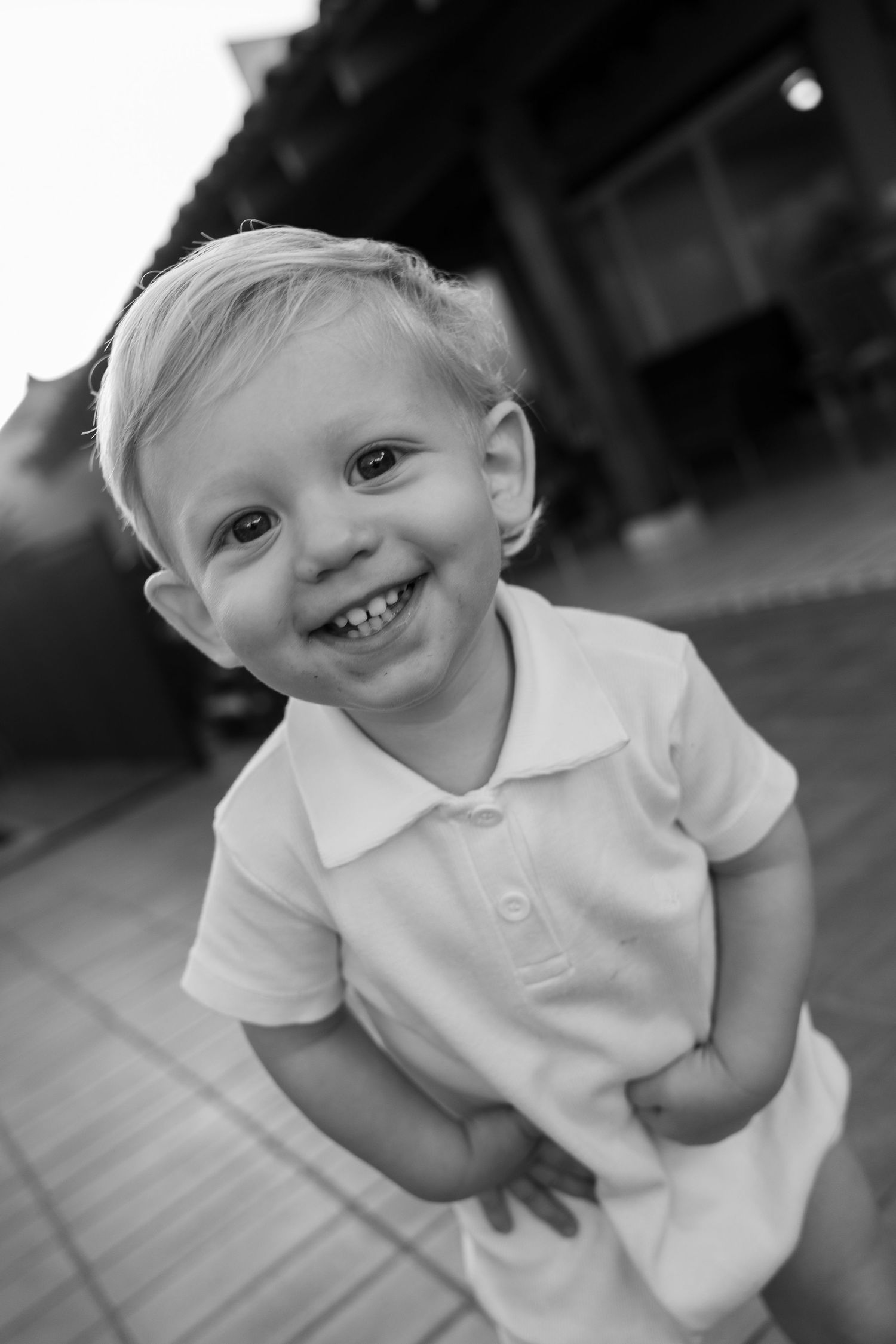 Black and white portrait series showing joyful expressions and smiles.