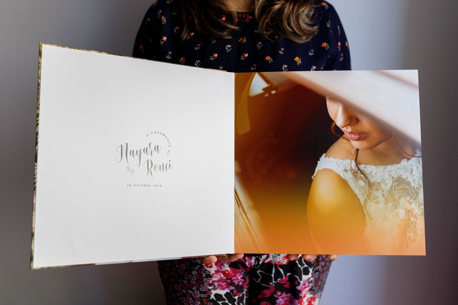 Wedding stationery and paper goods displayed in soft lighting.