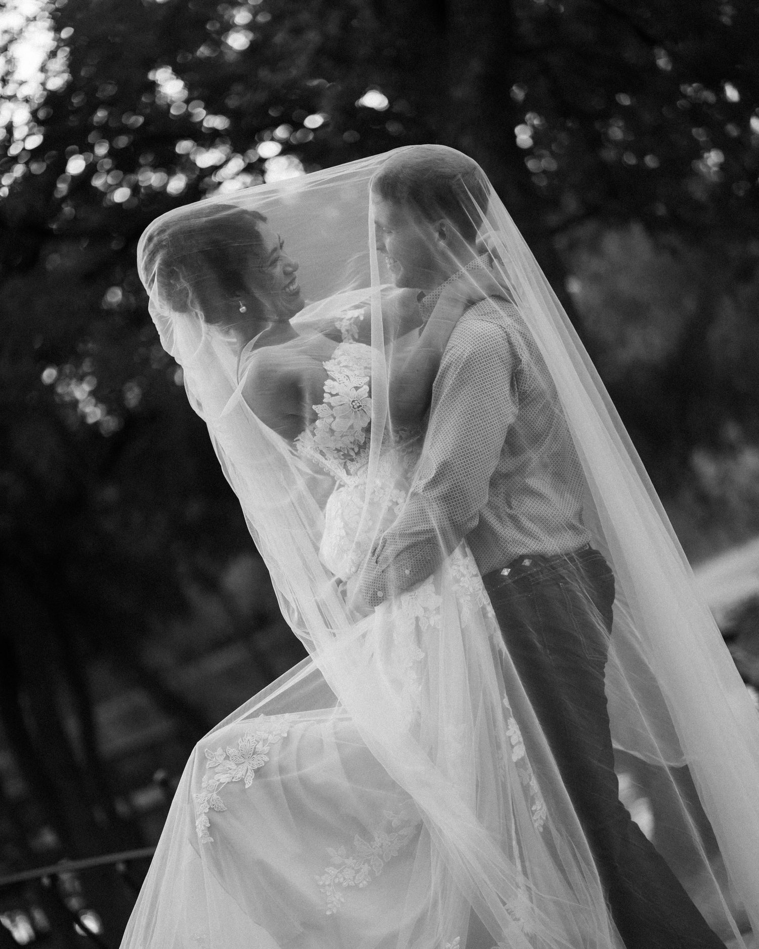 A series of black and white photos showing a bride's veil flowing in the wind during an outdoor photoshoot.