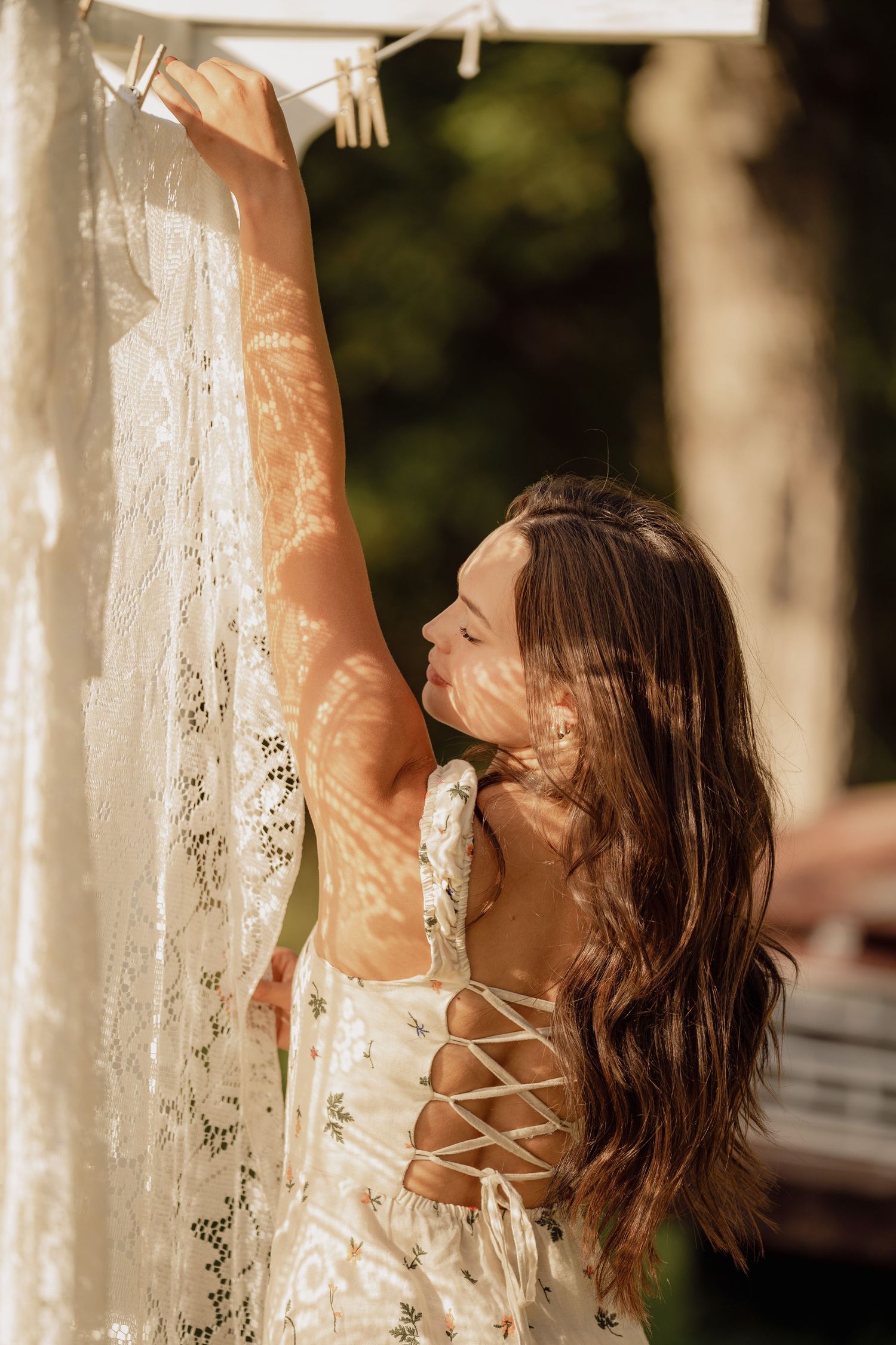 A dreamy portrait session with white fabric in natural sunlight.