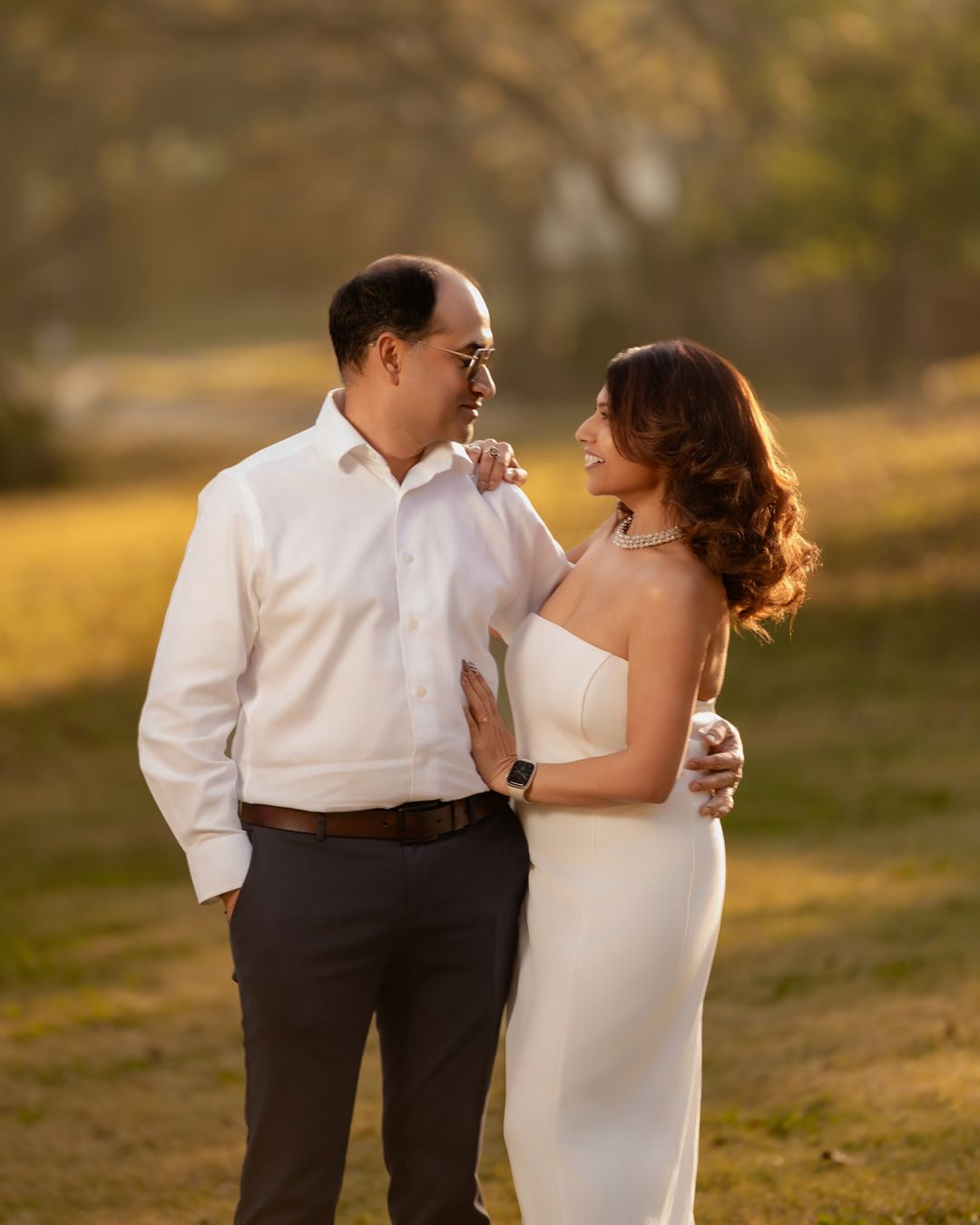 Sunset engagement photoshoot in a natural outdoor setting.
