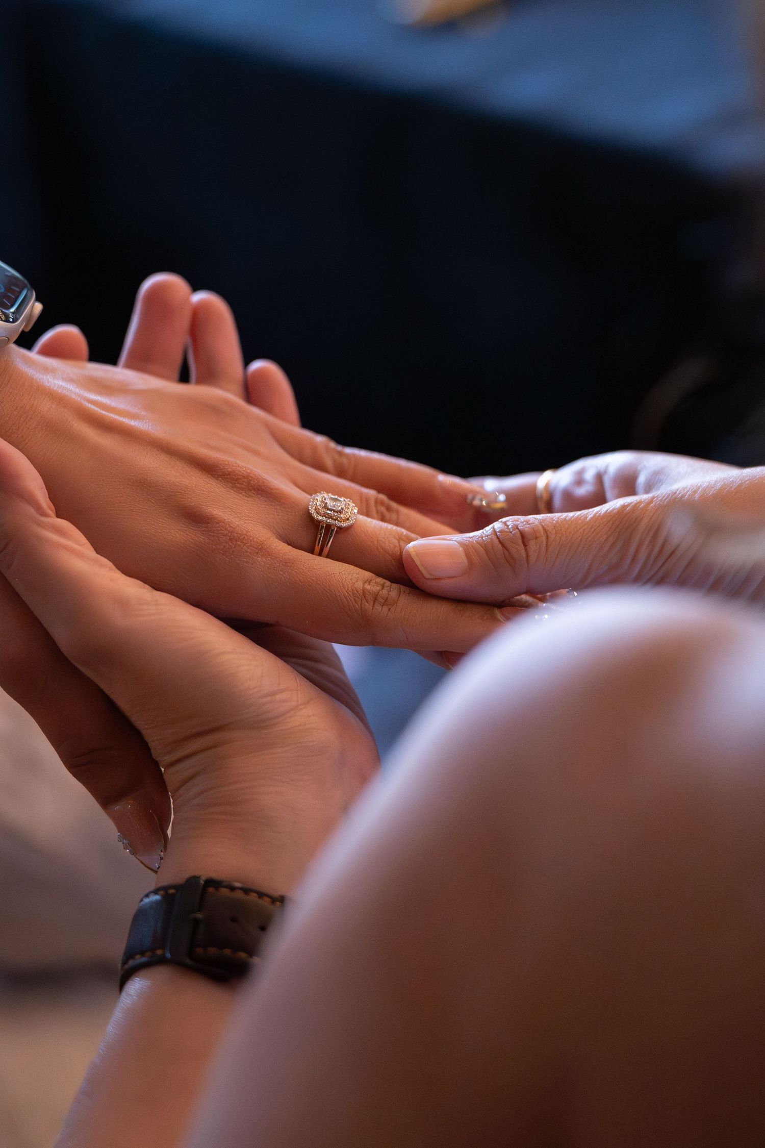 Close-up view of hands giving a relaxing massage therapy treatment on a massage table.