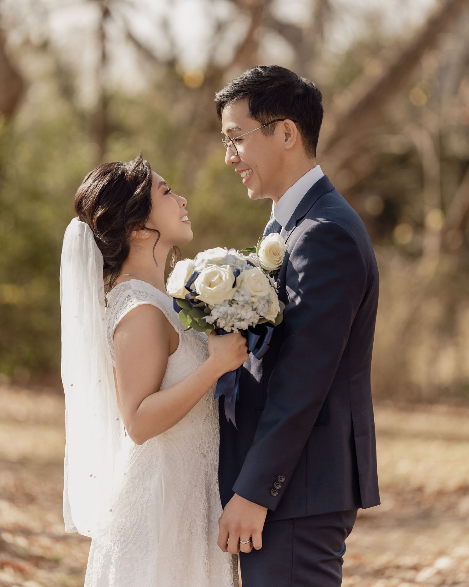 A romantic outdoor wedding photo sequence with white floral bouquets and natural lighting.