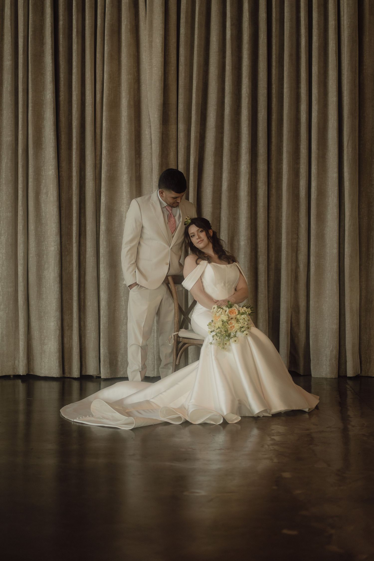 Artistic wedding portrait series against neutral curtain backdrop showing movement and flow.
