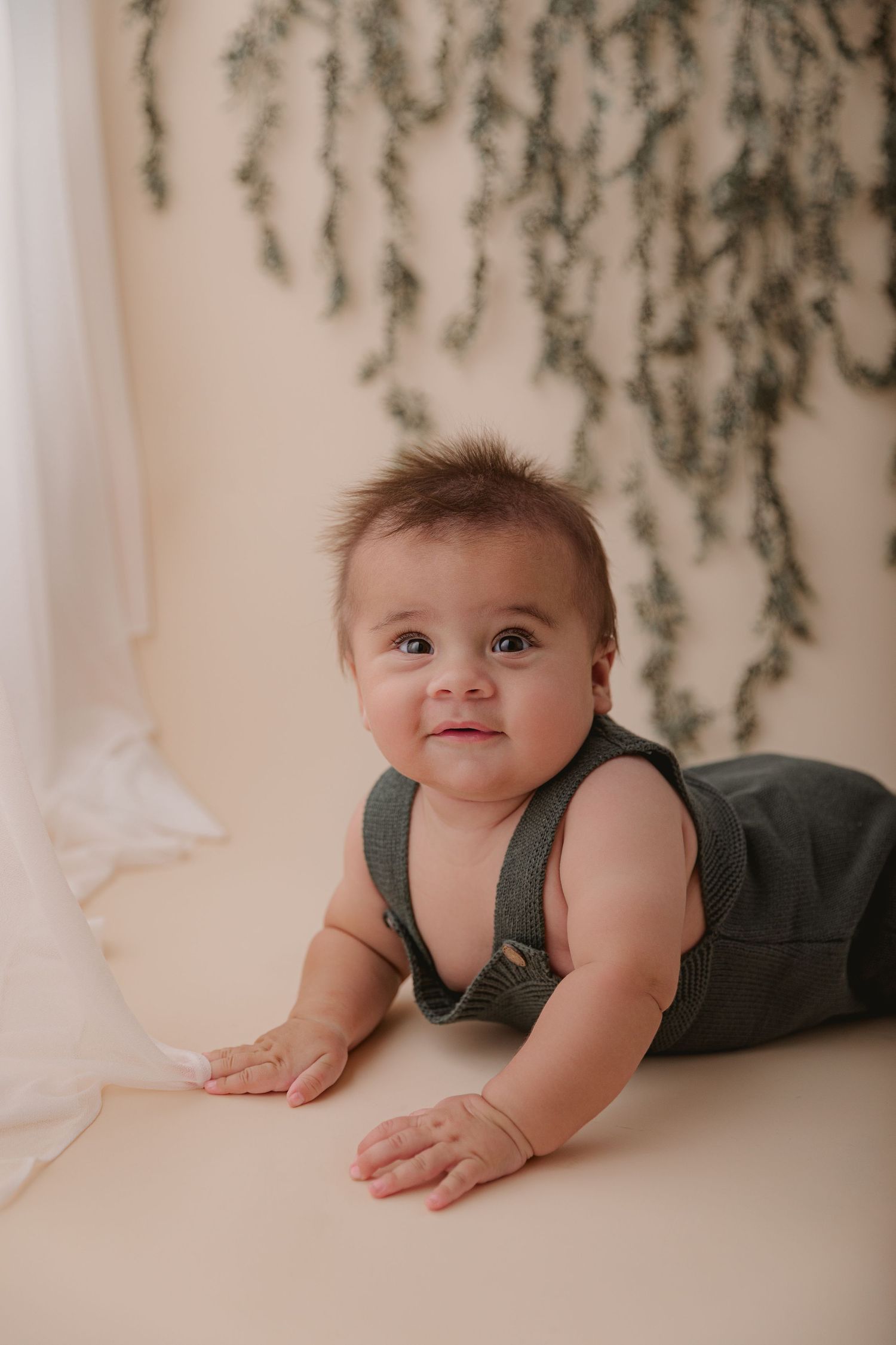 six month old baby enjoying tummy time for milestone session in San Jose