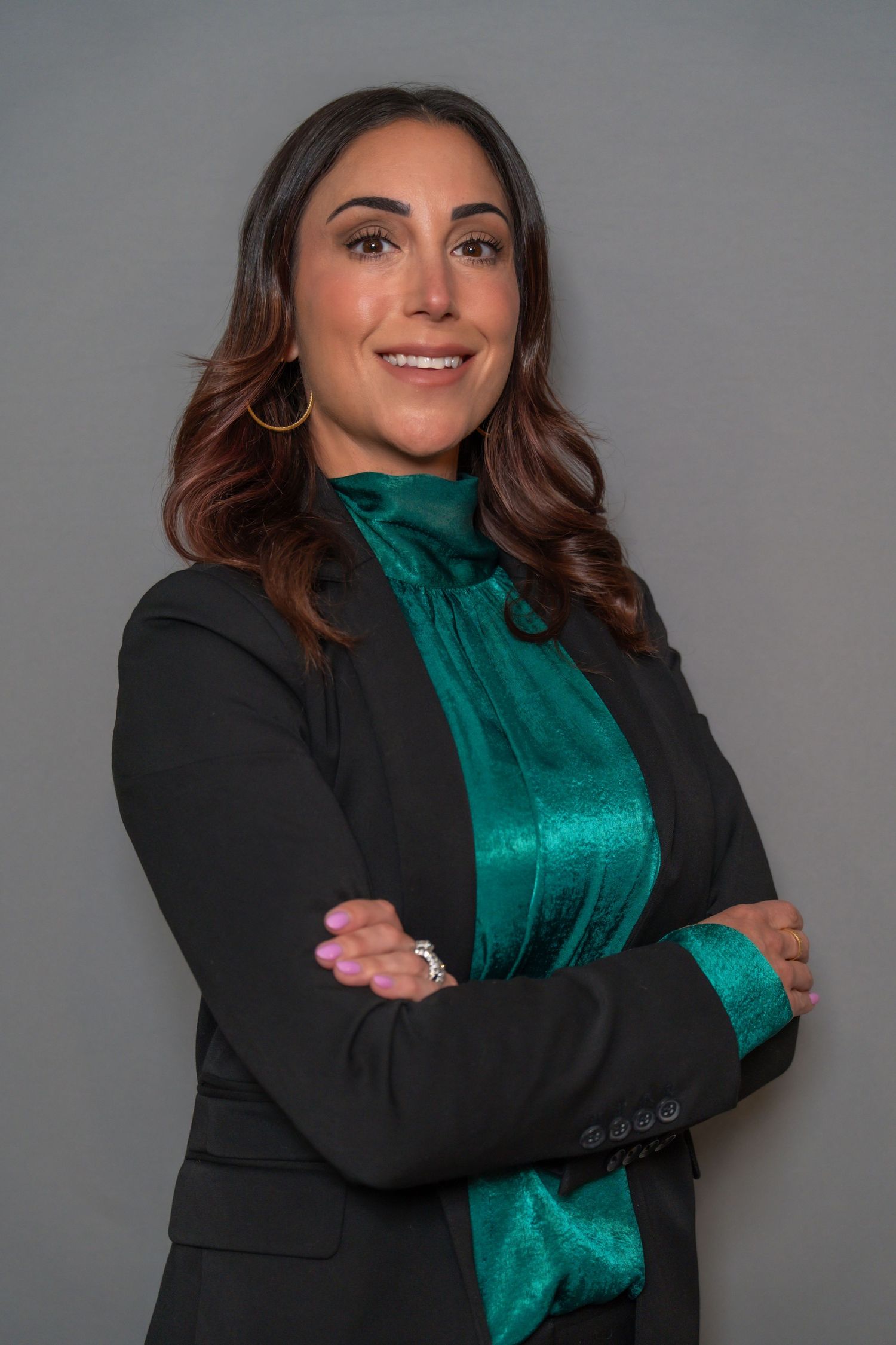 In Home Studio-style headshot showcasing confident business professional.