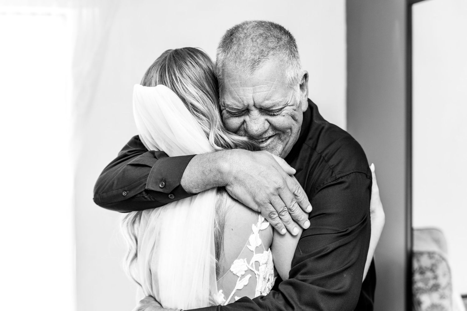 A black and white photo collage showing tender emotional moments between a couple at their wedding ceremony.