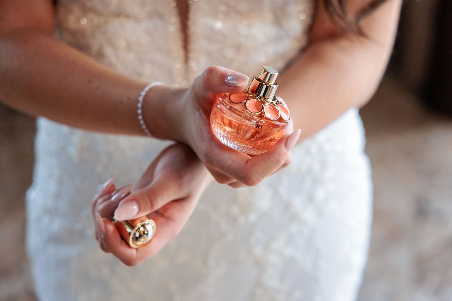 Close-up shots of hands holding wedding rings and jewelry details.