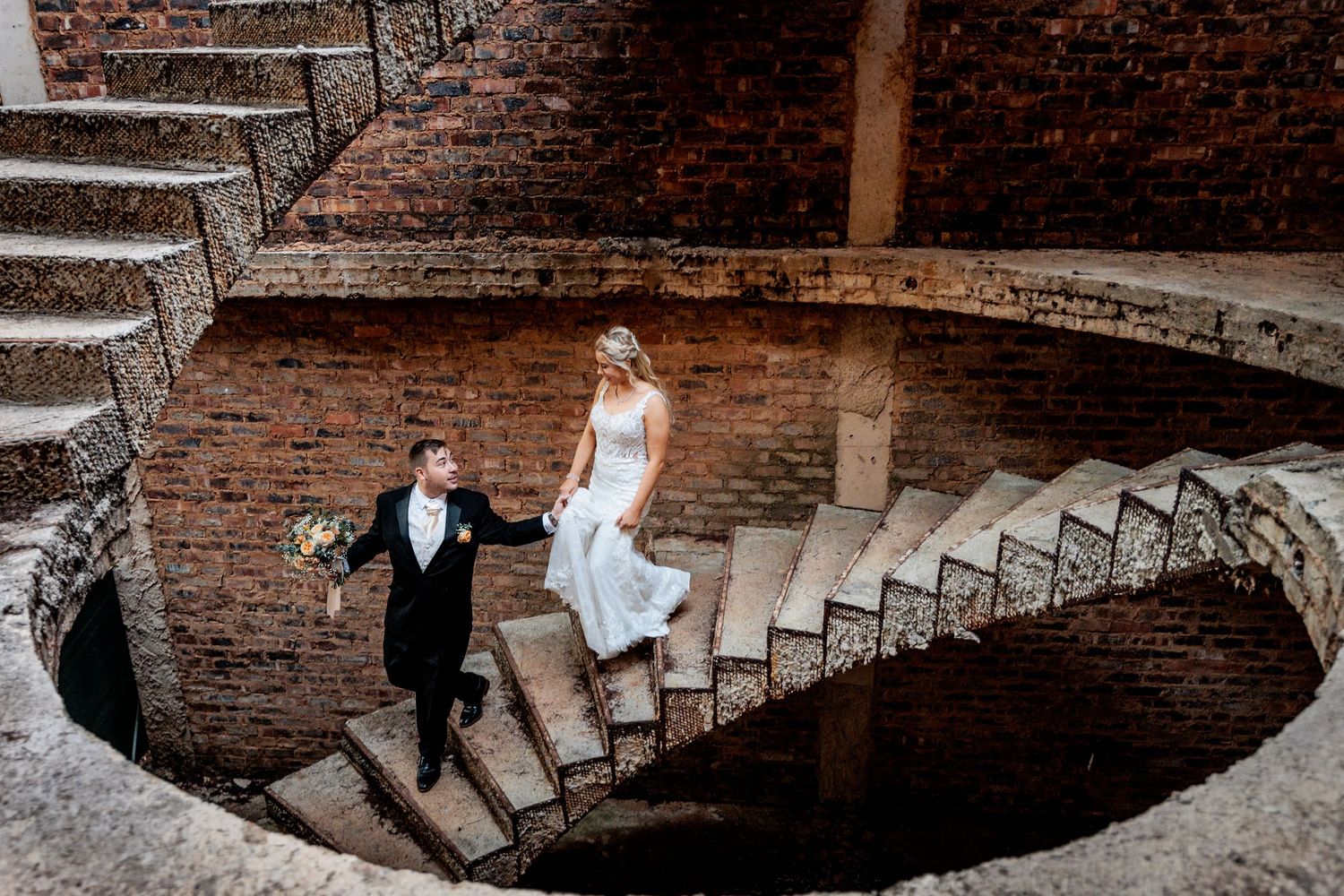 Historic spiral brick staircase photographed from multiple dramatic angles.