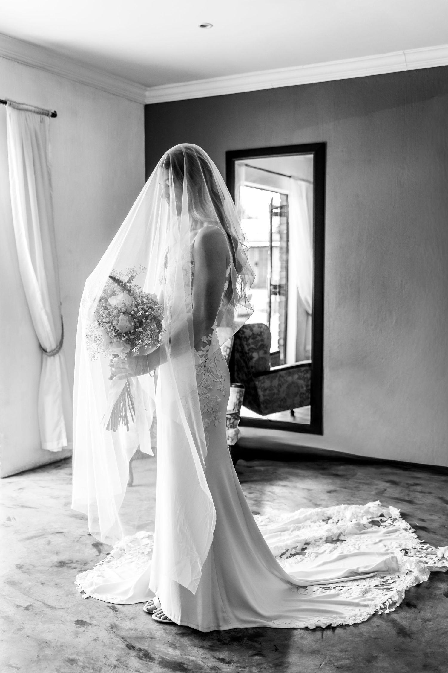 A series of black and white photos showing a wedding dress train trailing elegantly across a hardwood floor.