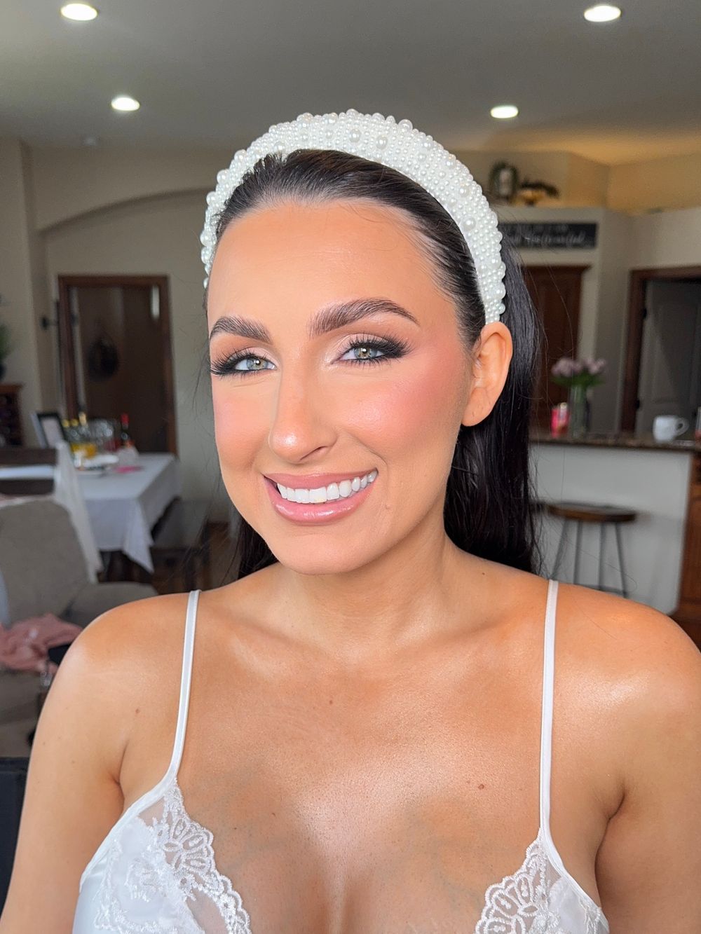 Elegant portraits featuring white lace details, dramatic eye makeup and a radiant smile.