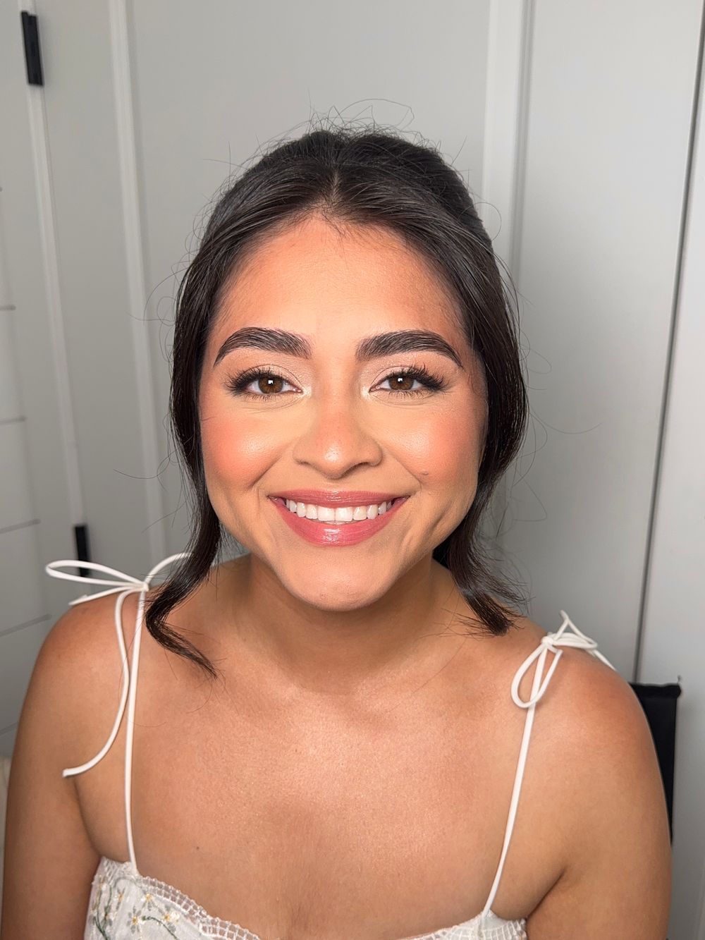 Close-up portrait series showing radiant bridal makeup with white lace details.