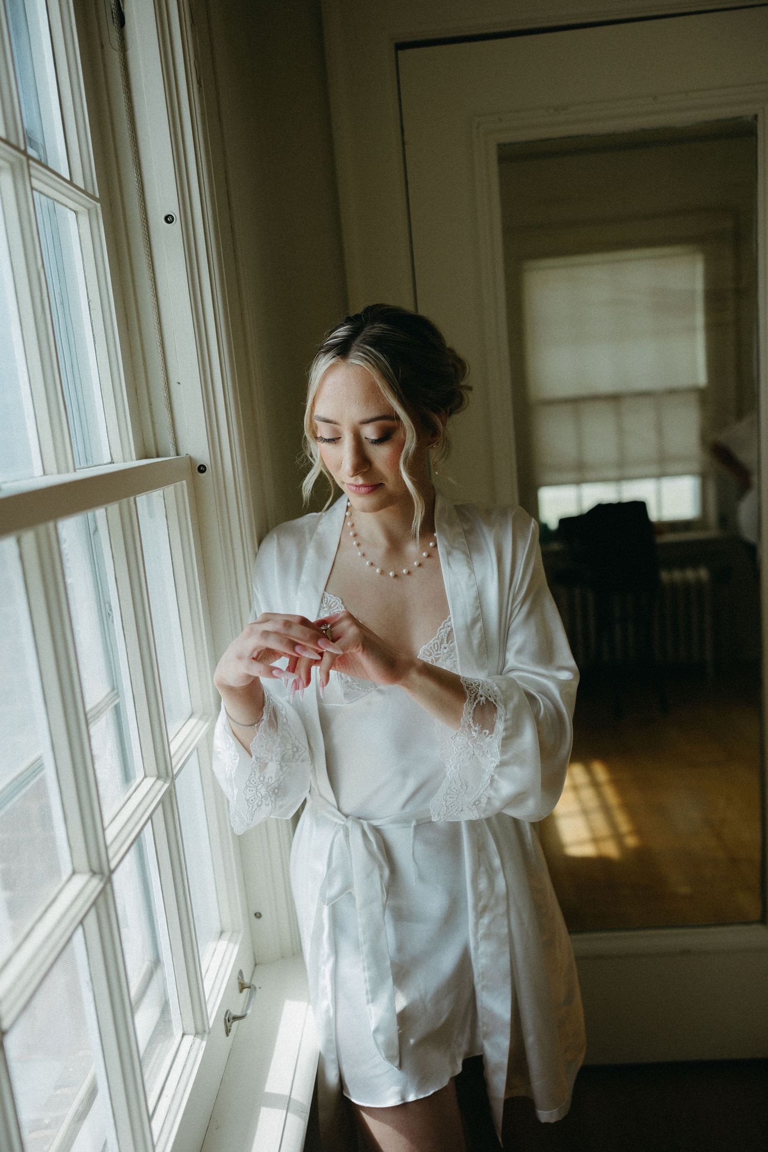 Getting ready scene by a bright window with soft morning light.