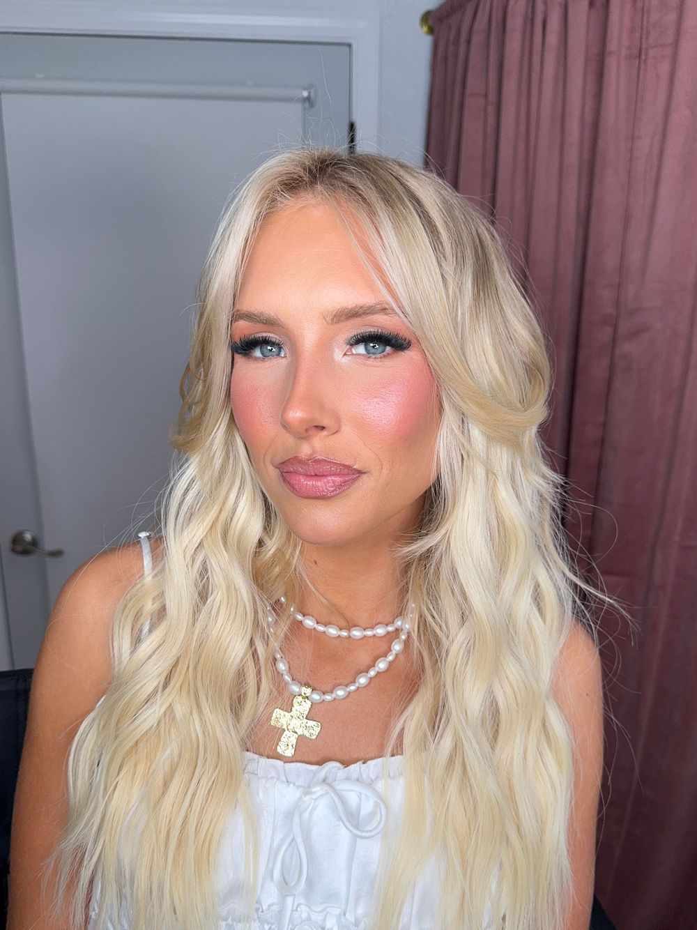 Bridal beauty shots featuring wavy blonde hair, pearl necklace and white lace dress details.