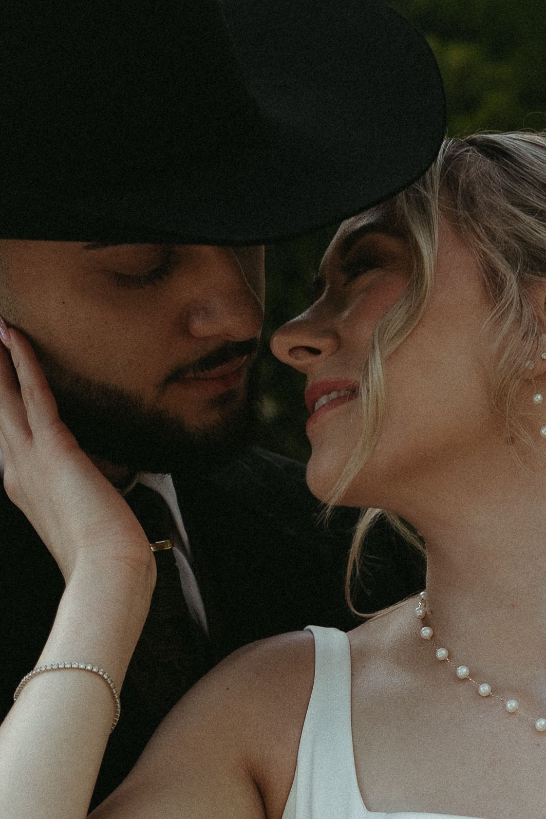 Intimate romantic moment captured in dramatic lighting.