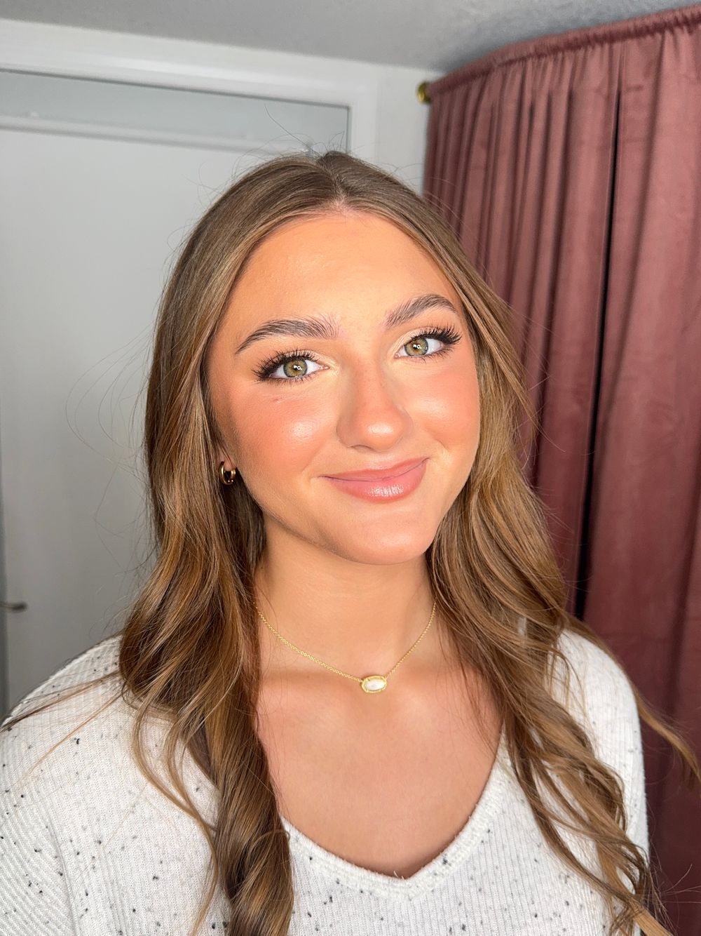 Close-up bridal beauty shots showing soft waves and natural glam makeup.