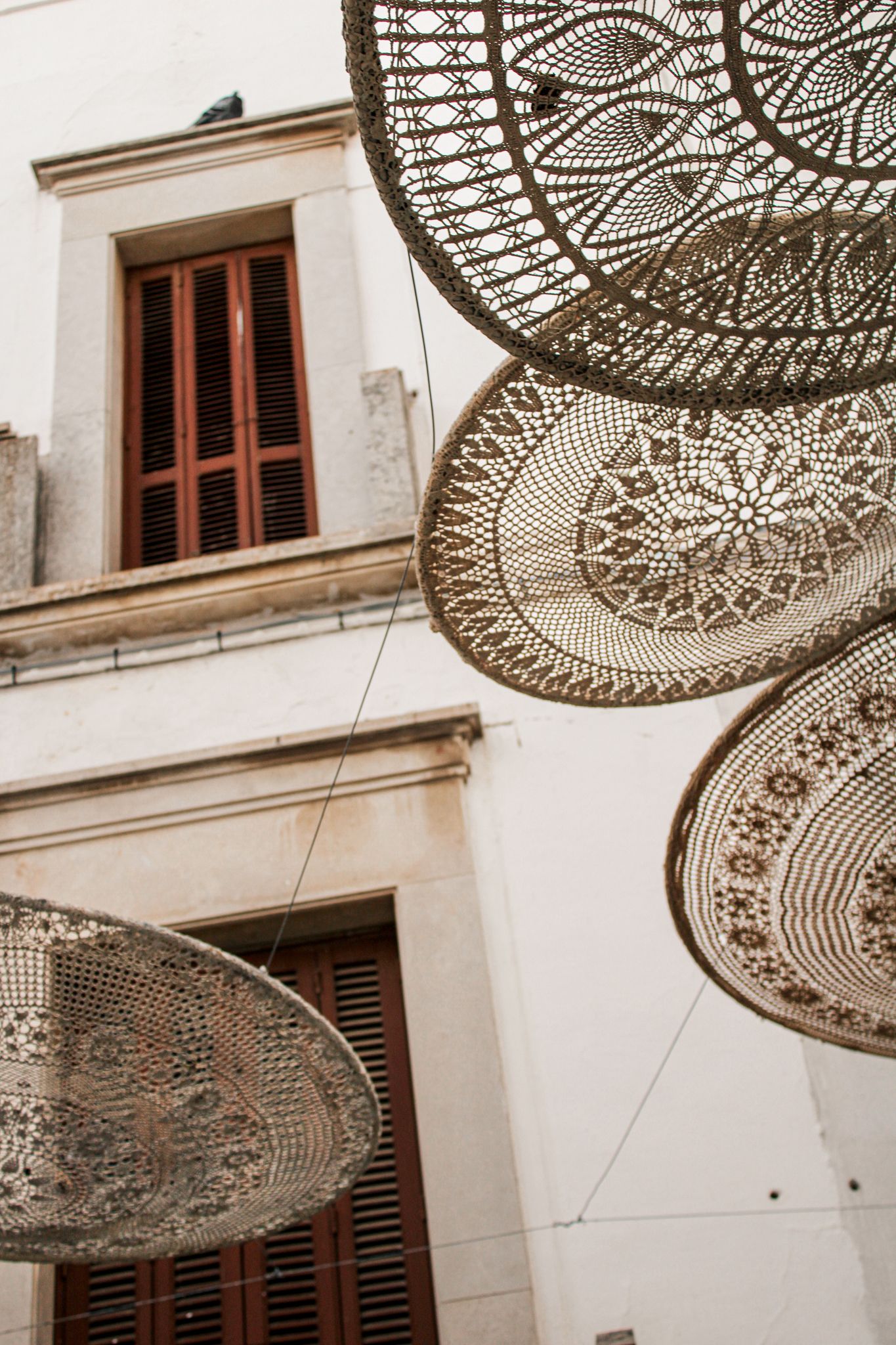 Whitewashed street with woven decorations in Locorotondo, Puglia