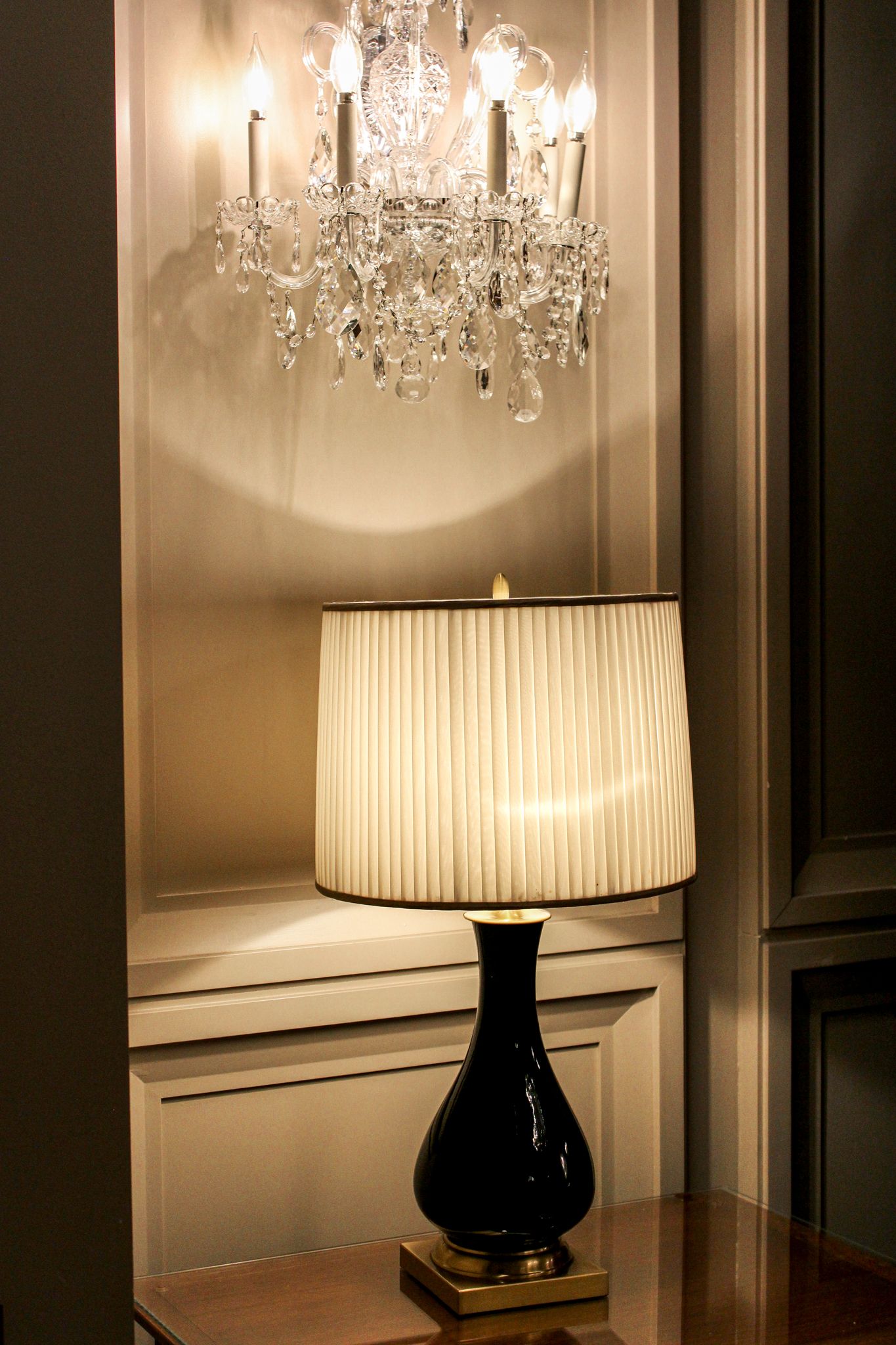 Elegant lobby at Omni Shoreham Hotel in Washington, D.C., featuring a table lamp and chandelier in warm evening light