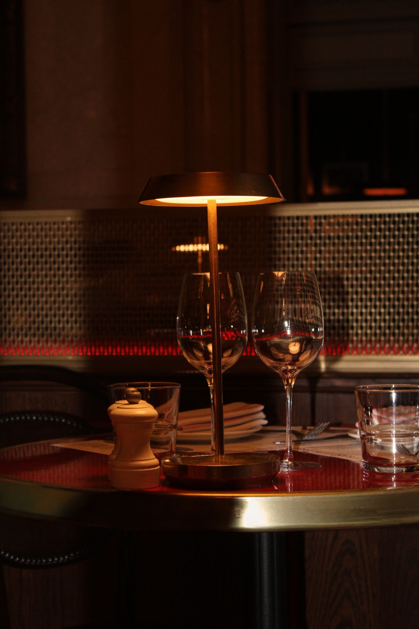 Intimate table setting at Grand Brasserie inside Grand Central Terminal in New York with warm evening lighting