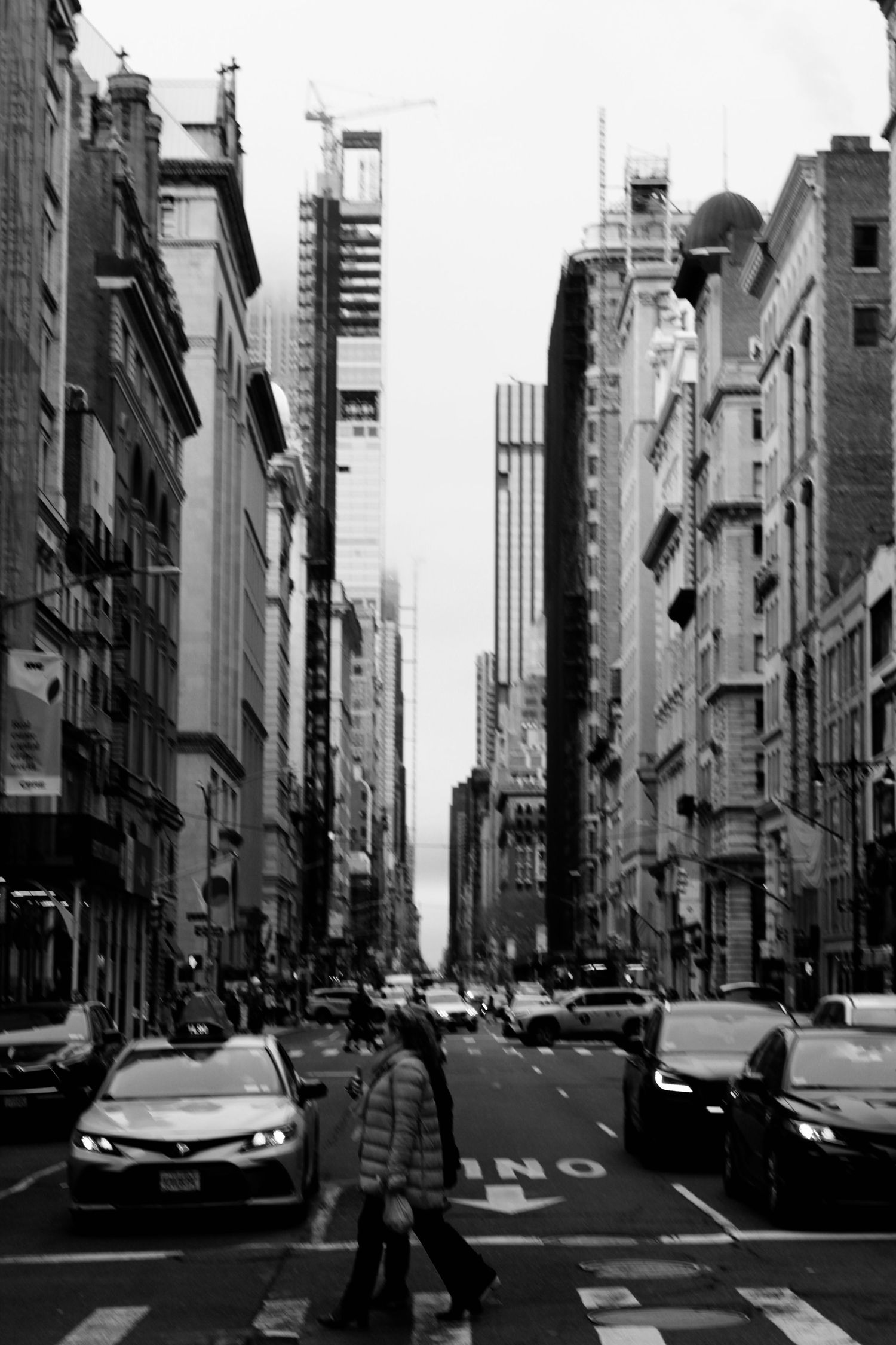 Black and white street scene capturing the energy of Midtown Manhattan, New York City