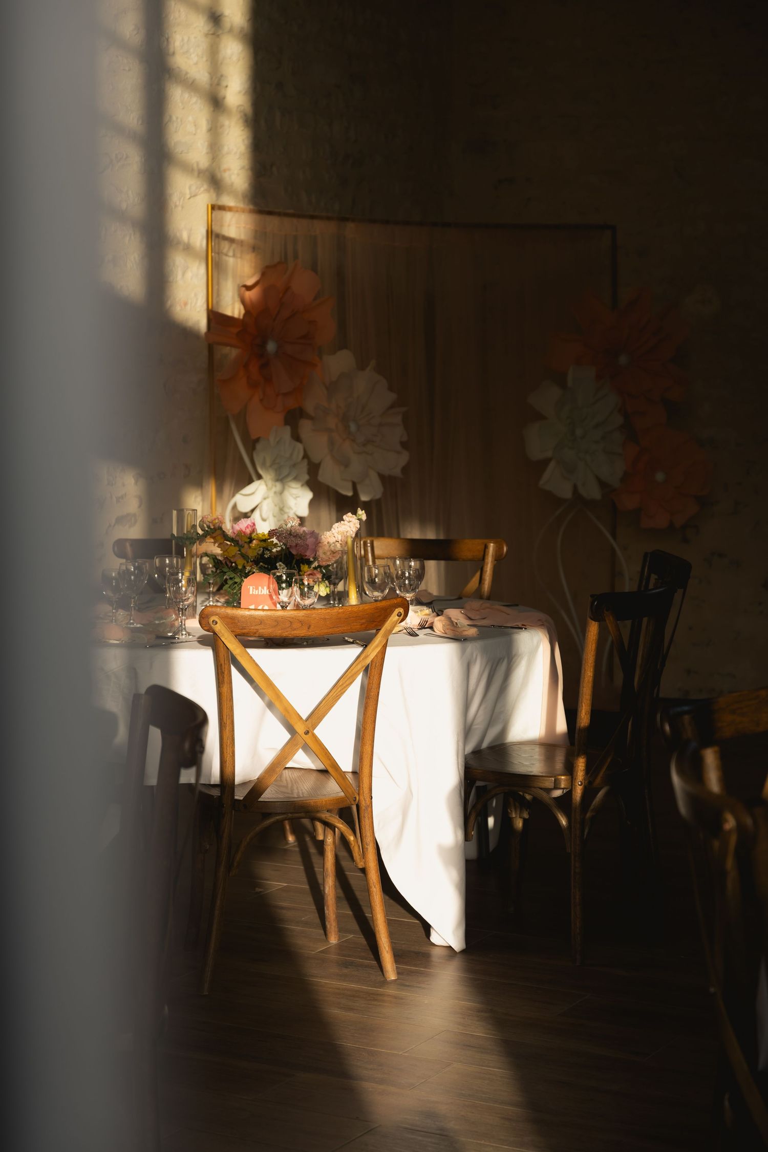 Wedding reception tables beautifully set in soft morning light