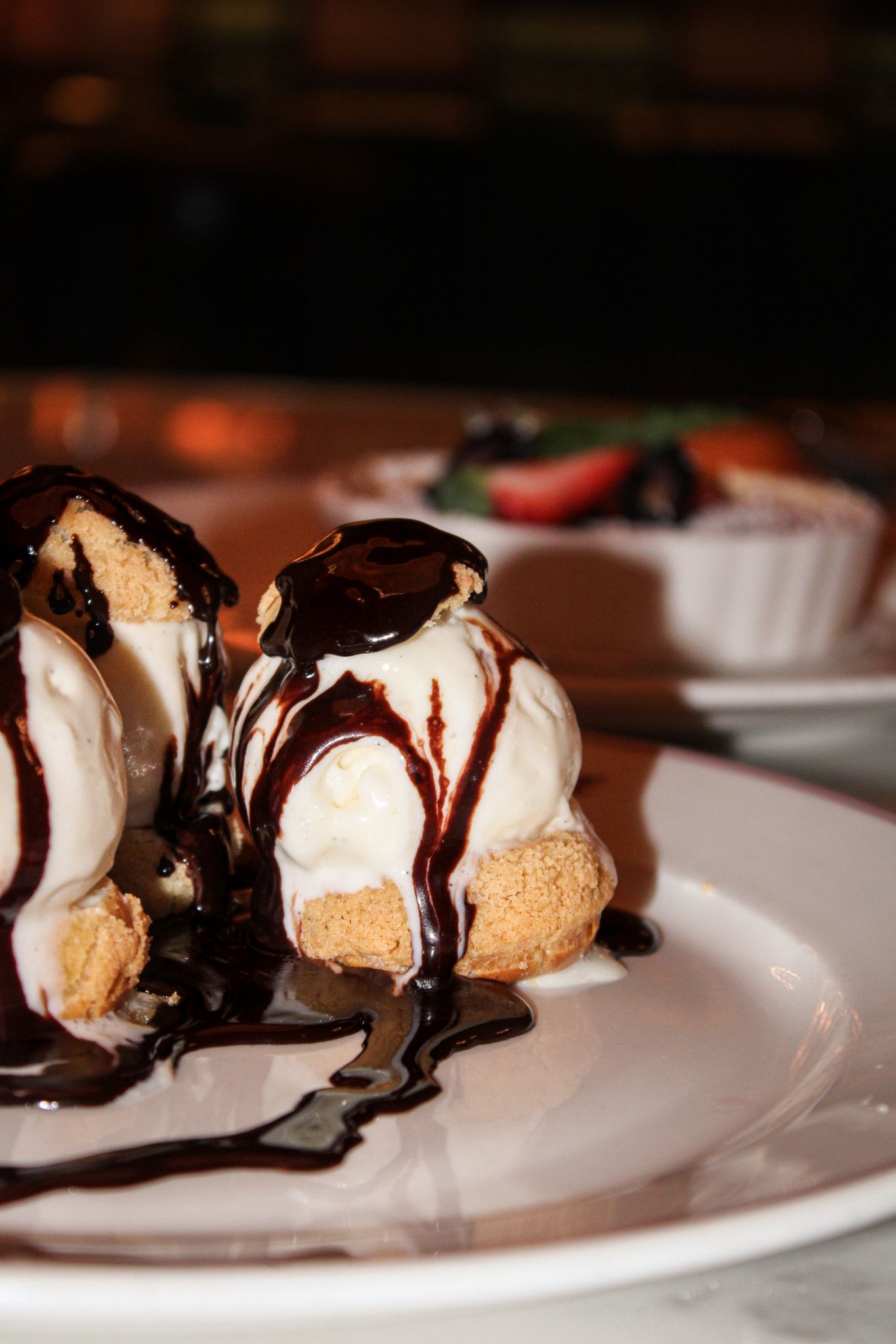 French profiteroles with vanilla ice cream and chocolate ganache at Grand Brasserie in New York