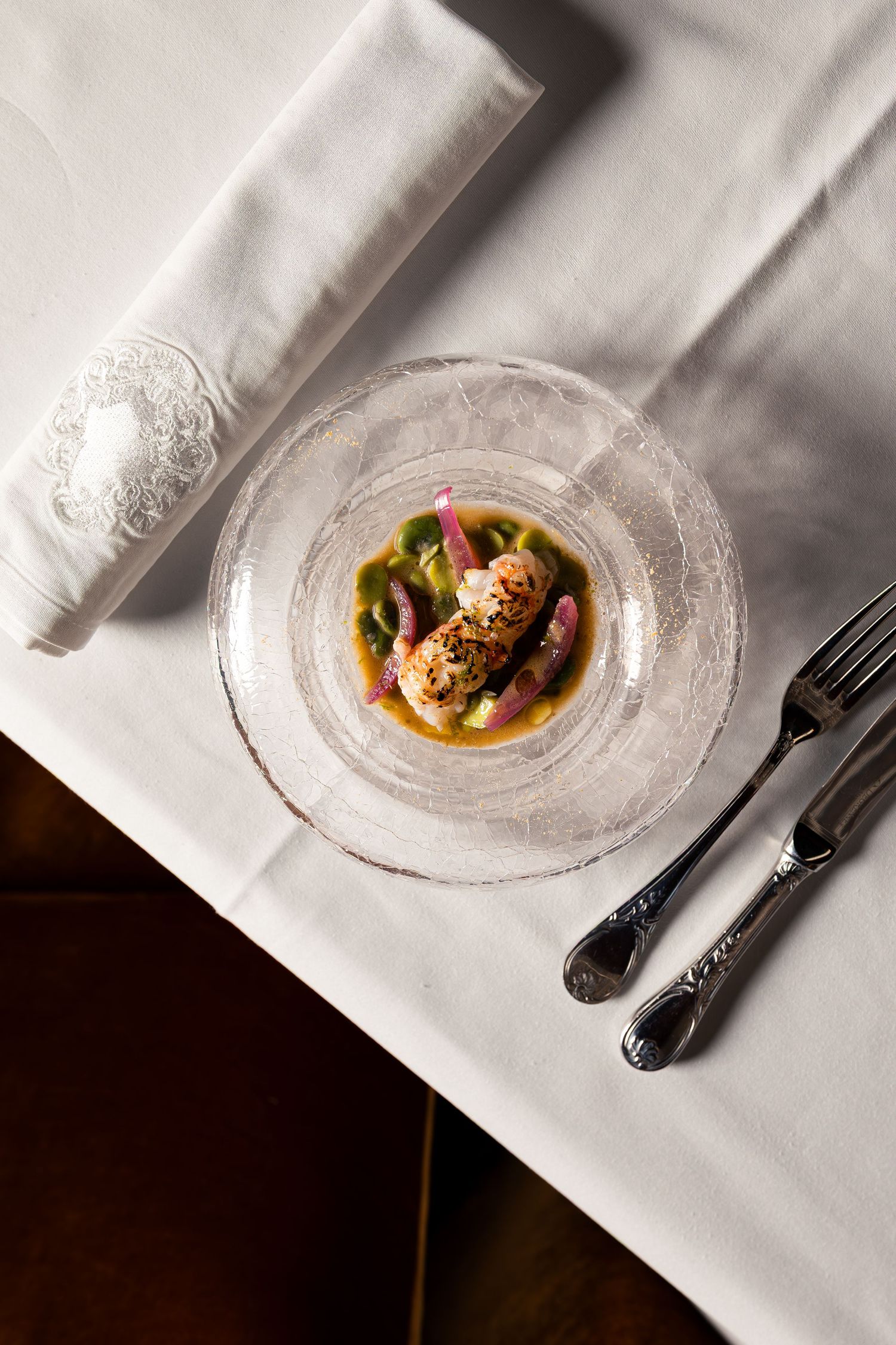 Roasted langoustines with vanilla reduction and farm vegetables at Félicité restaurant, Maison Maubreuil