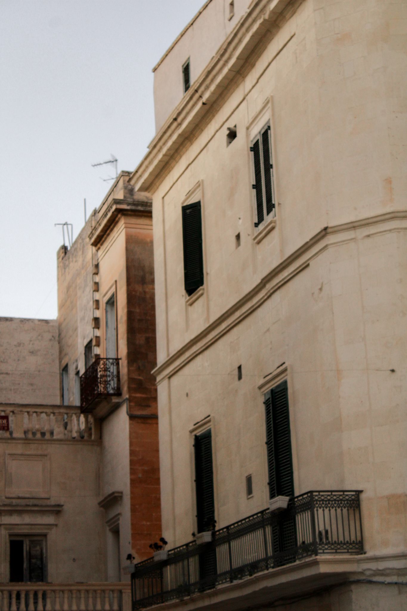 Historic architecture in Lecce, Puglia, illuminated by warm summer evening light