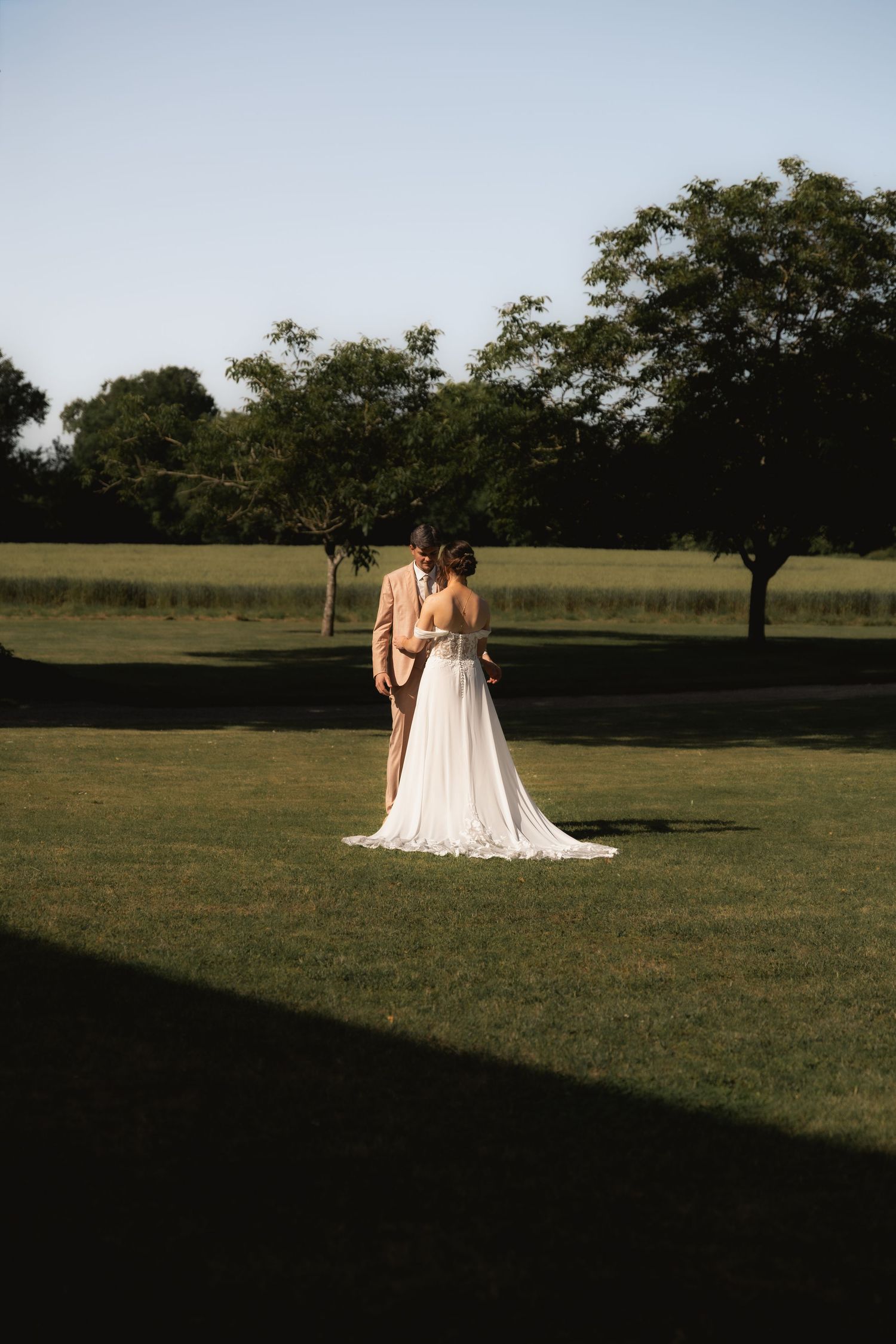 Bride and groom sharing a quiet moment together in a garden