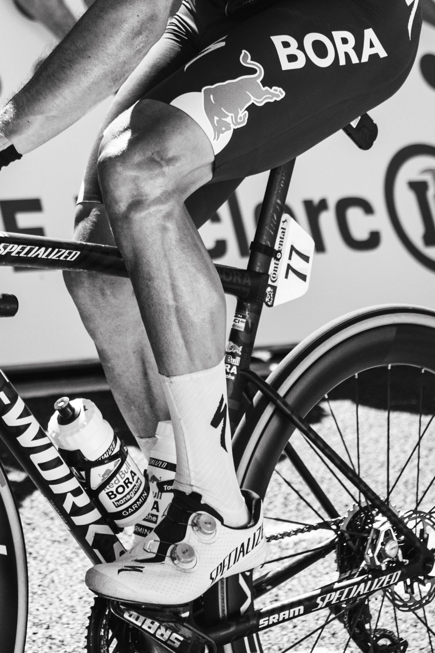 Action photography of cyclists during the Tour de France, motion, energy and determination in a dynamic sports atmosphere.