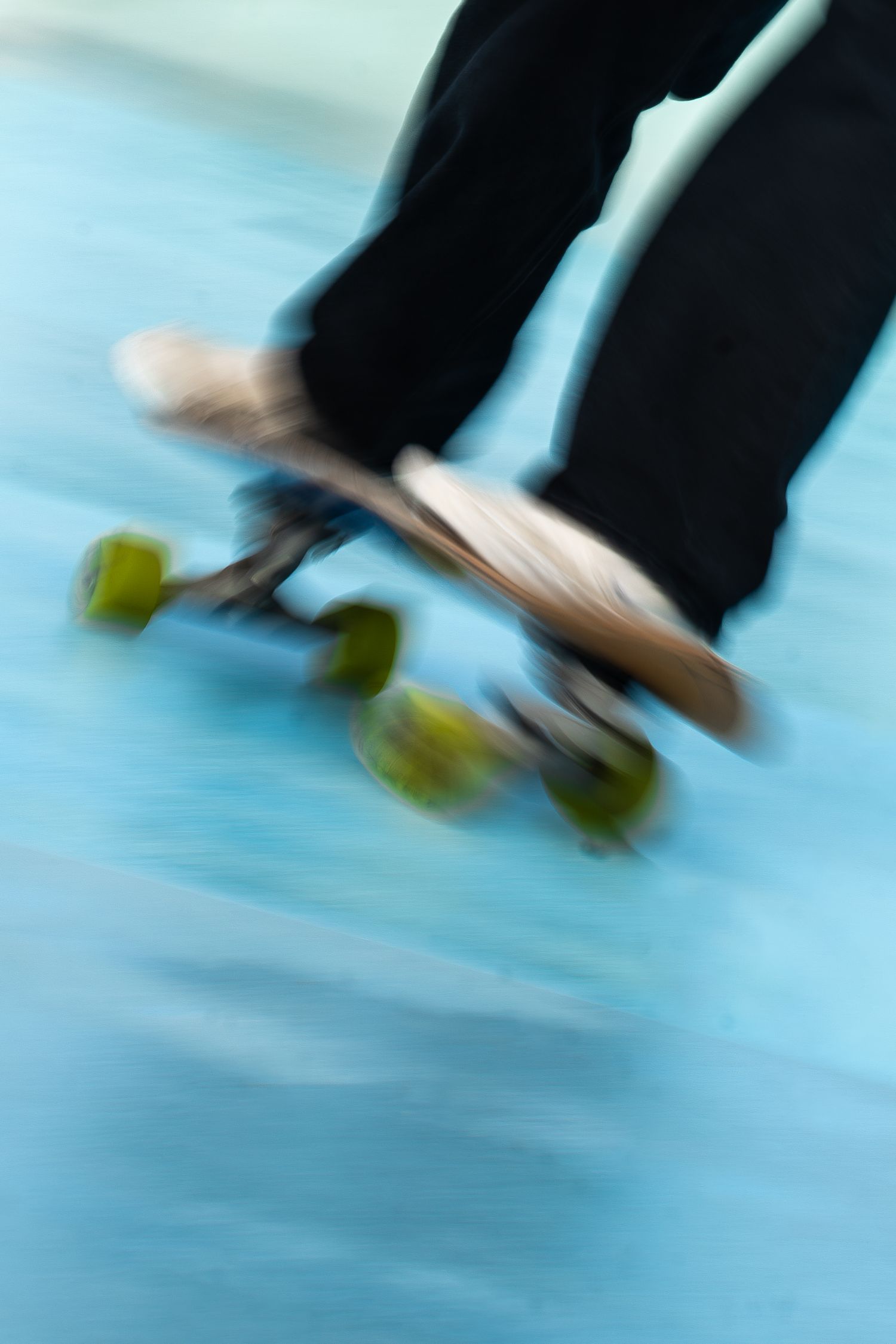 Skateboard competition on the beach, athletes performing tricks with ocean in the background, dynamic movement and vibrant summer atmosphere