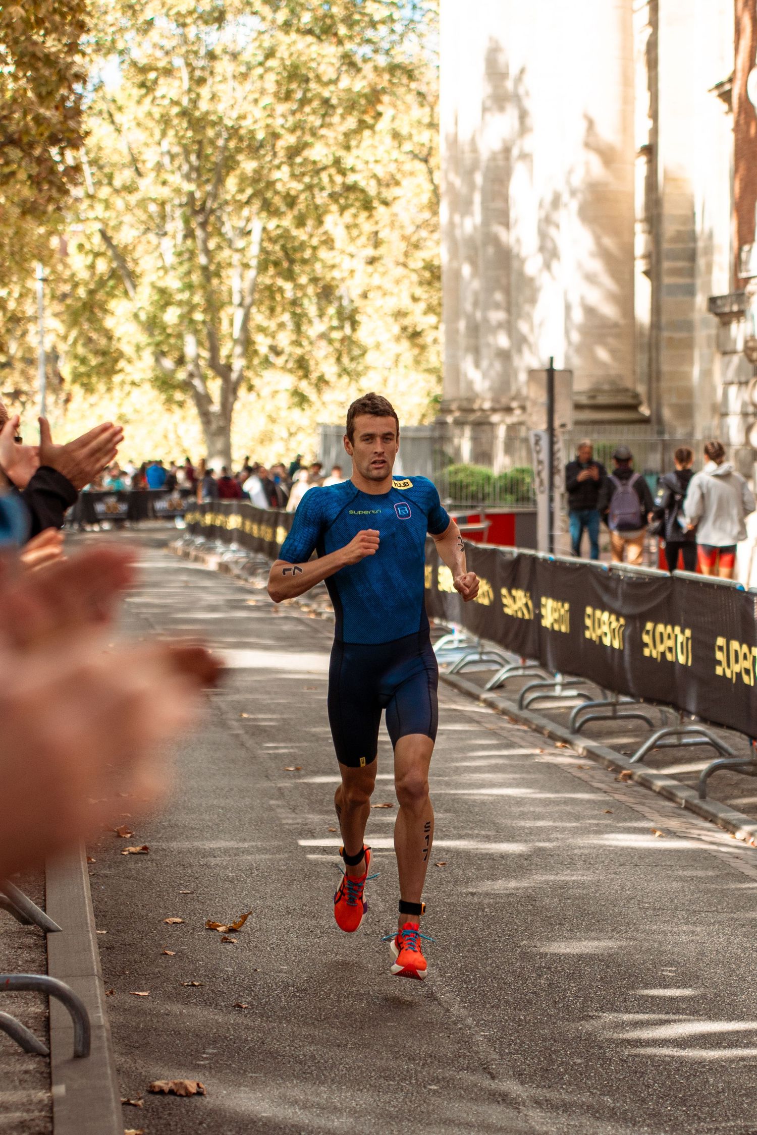 Triathlon competition photography capturing endurance athletes in motion, strength, focus and intense sporting atmosphere.