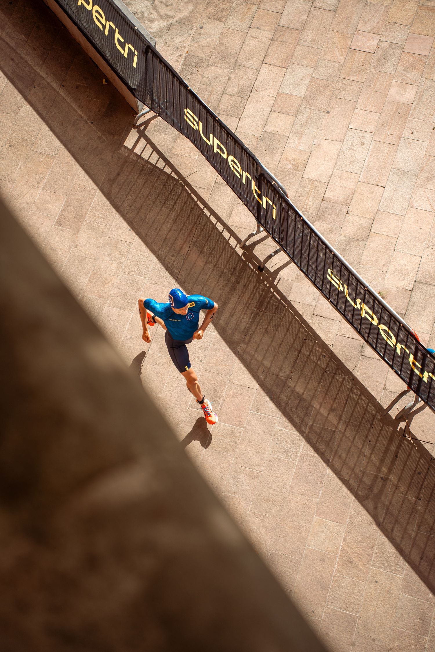 Triathlon competition photography capturing endurance athletes in motion, strength, focus and intense sporting atmosphere.
