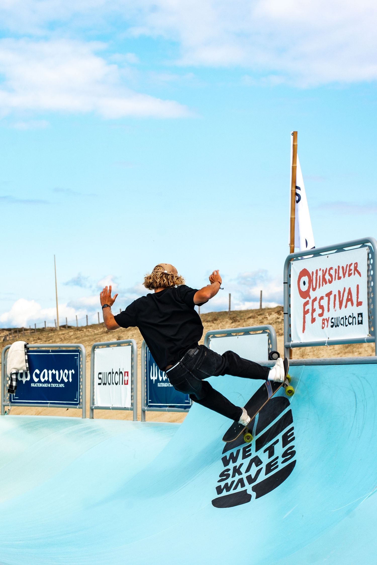 Skateboard competition on the beach, athletes performing tricks with ocean in the background, dynamic movement and vibrant summer atmosphere