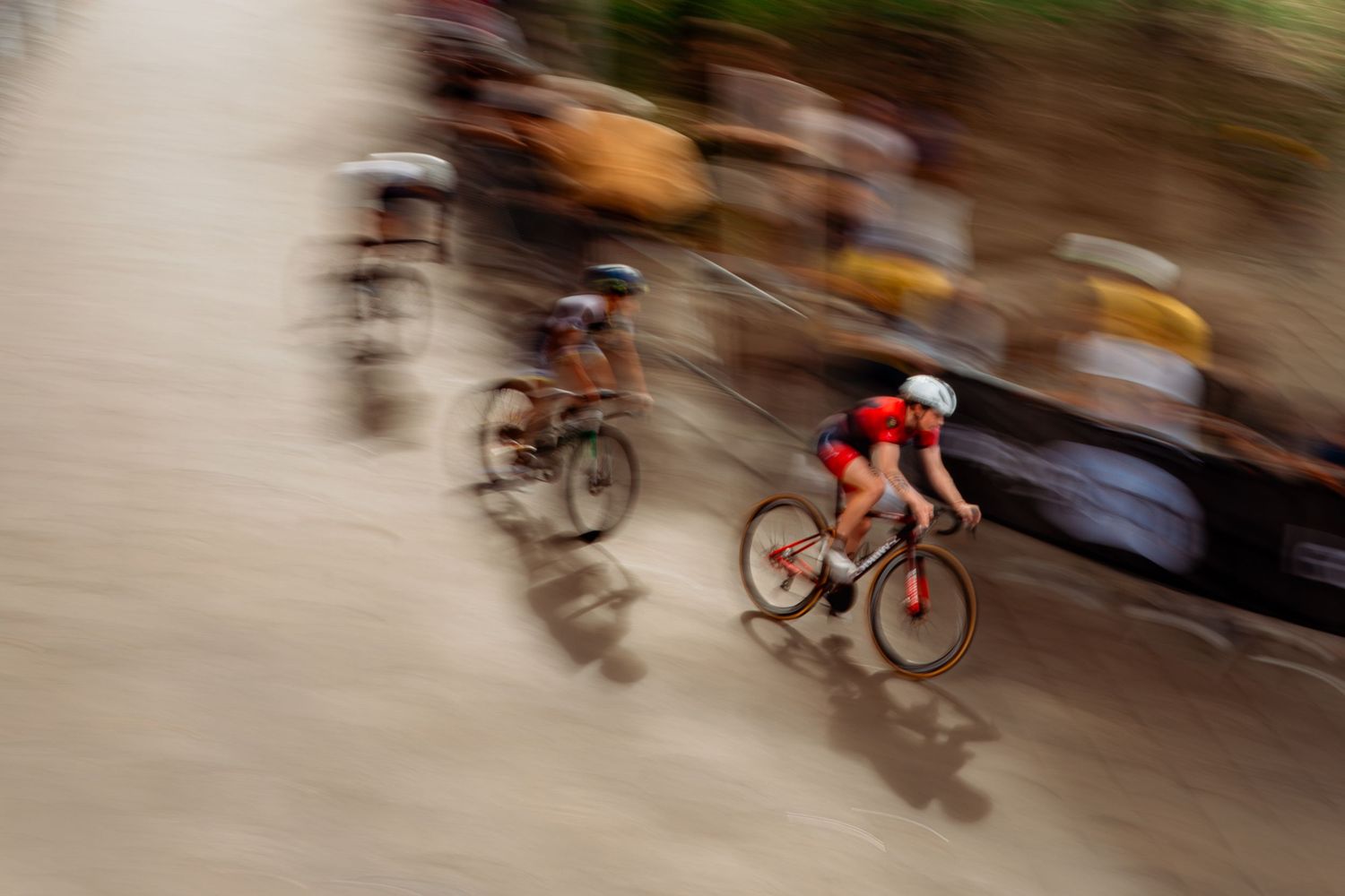 Triathlon competition photography capturing endurance athletes in motion, strength, focus and intense sporting atmosphere.