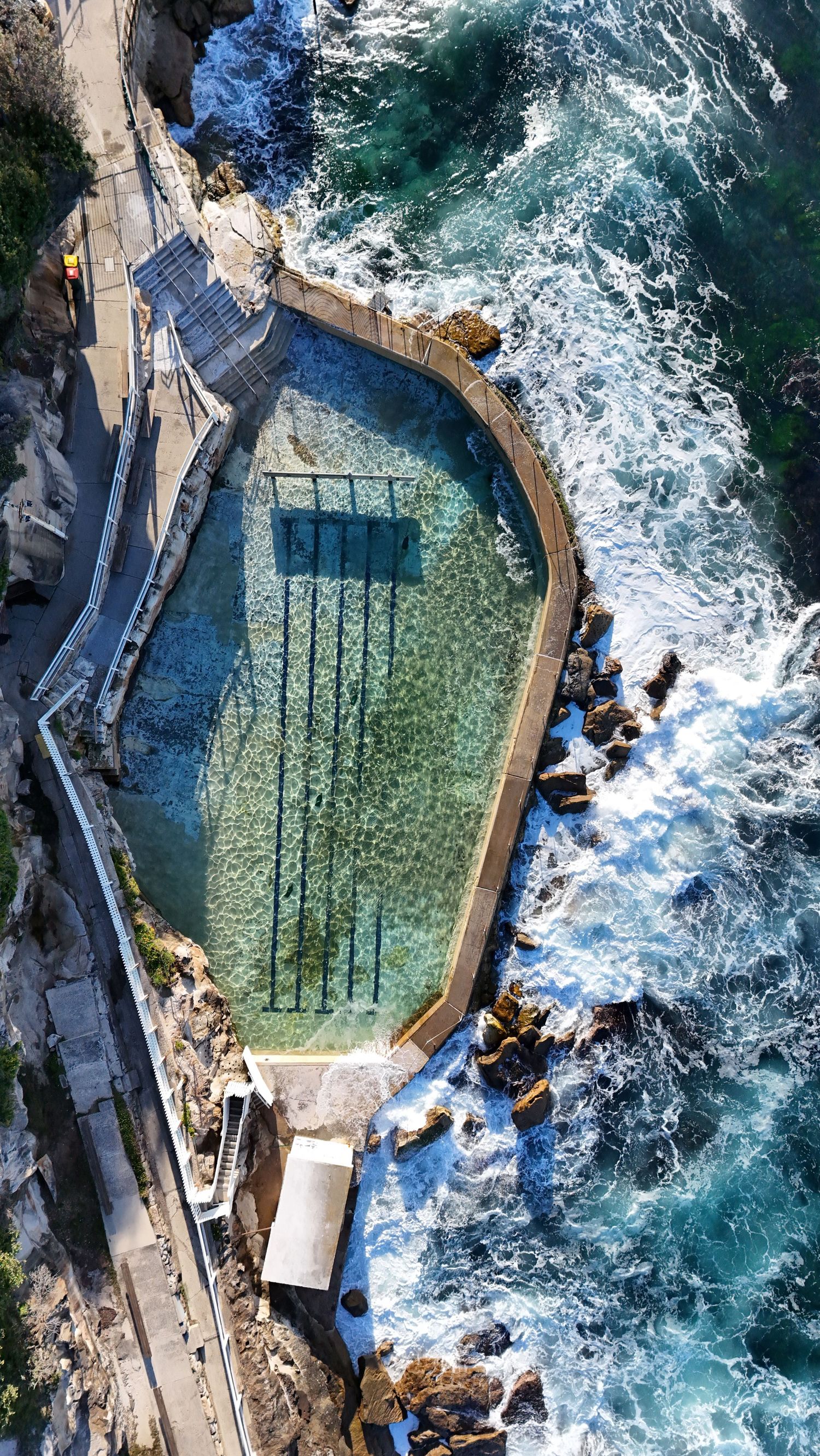 Aerial drone view of a travel destination, dramatic landscape, natural colors, cinematic composition capturing the beauty of the world.
