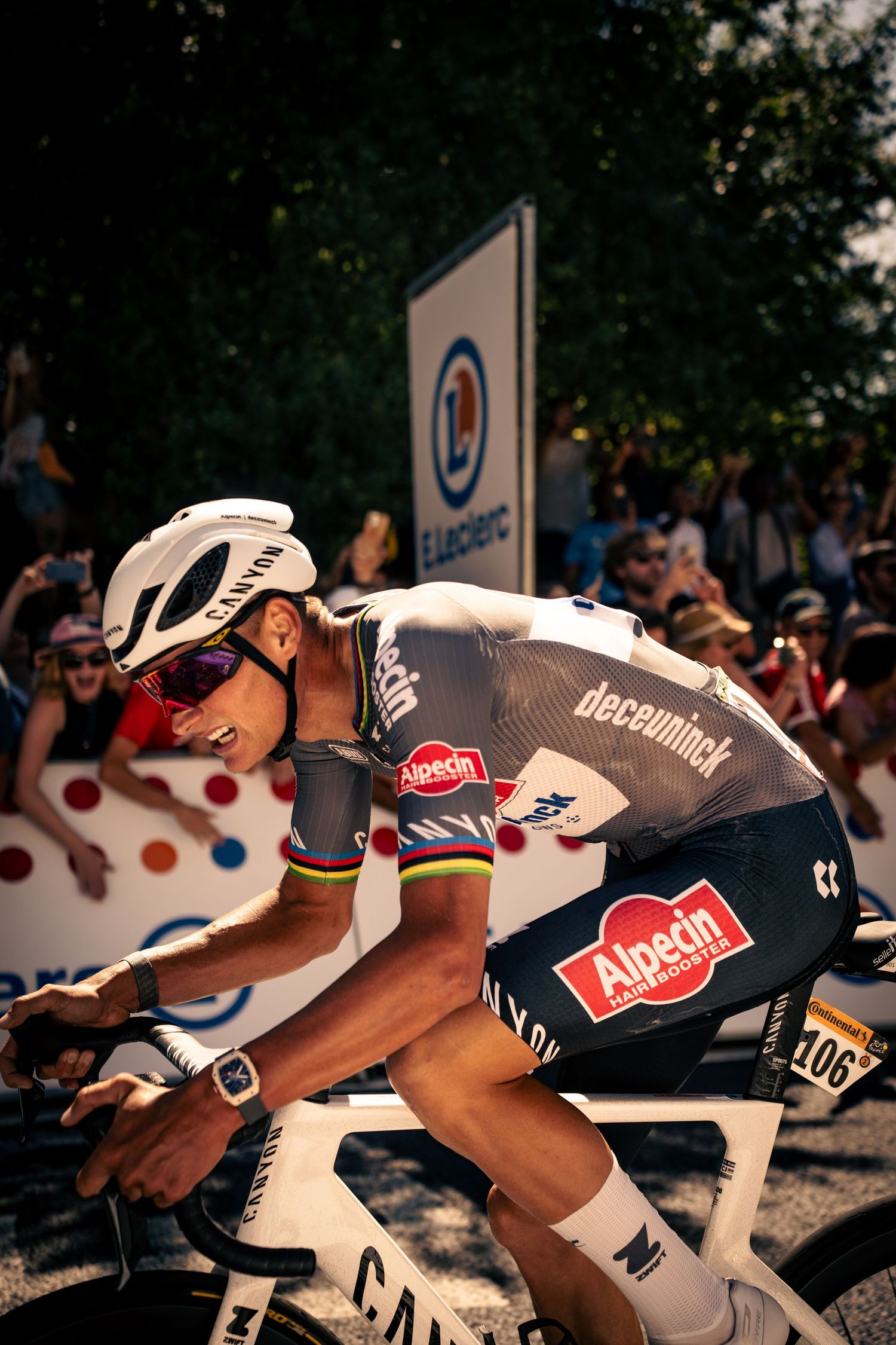 Action photography of cyclists during the Tour de France, motion, energy and determination in a dynamic sports atmosphere.