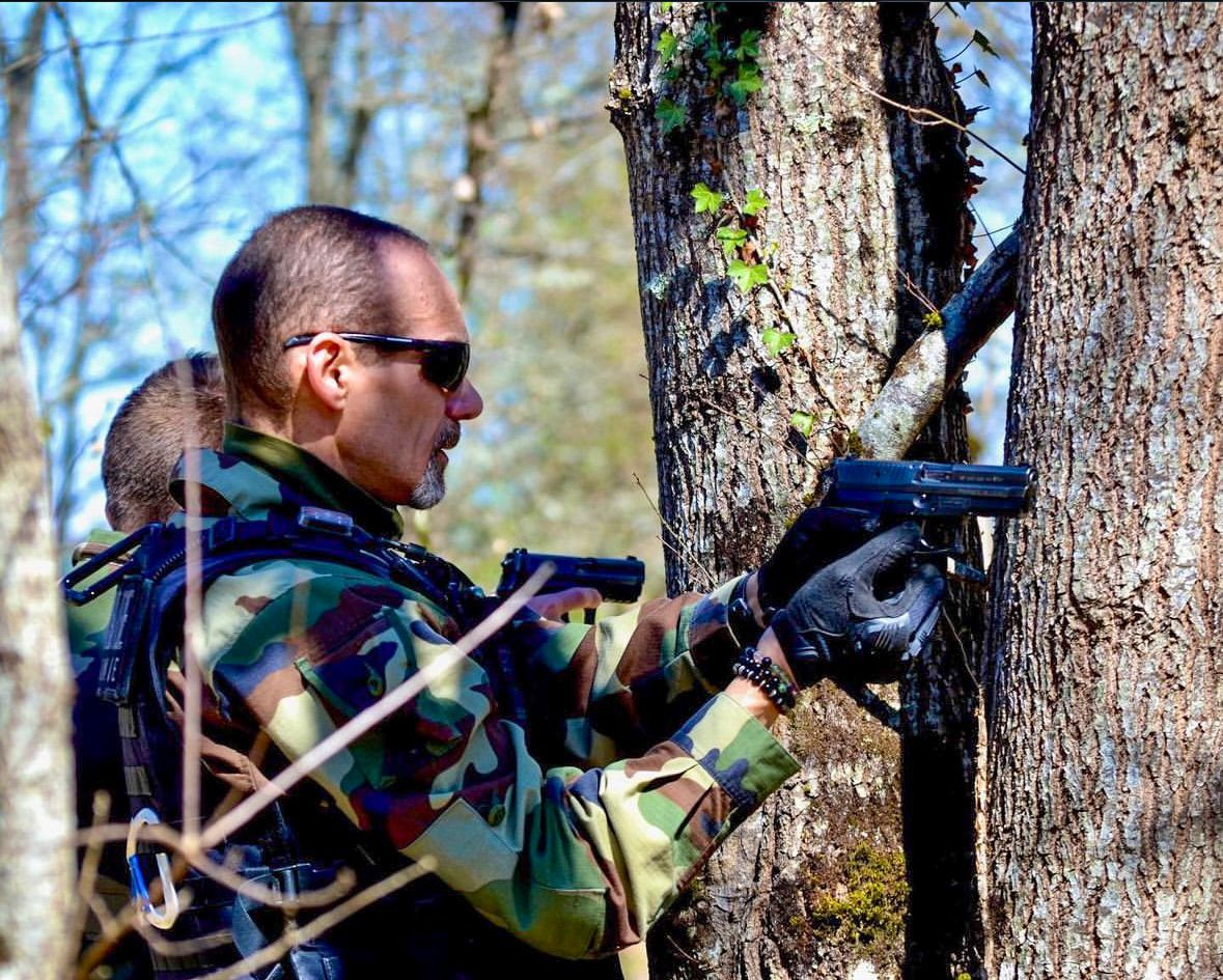 Professional photography of gendarmerie officers during training exercise, dynamic action, teamwork and intensity captured in natural light.