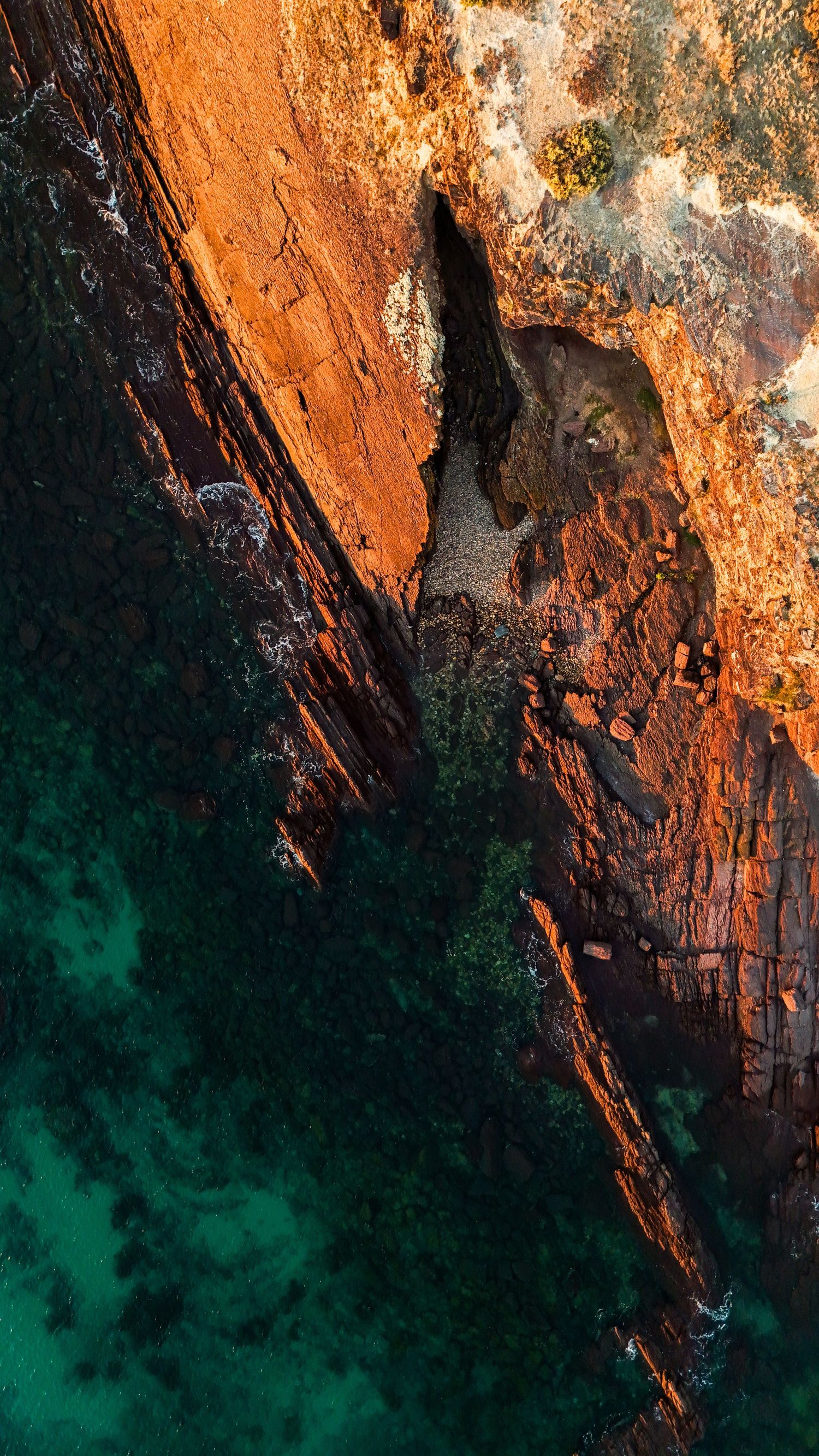 Aerial drone view of a travel destination, dramatic landscape, natural colors, cinematic composition capturing the beauty of the world.