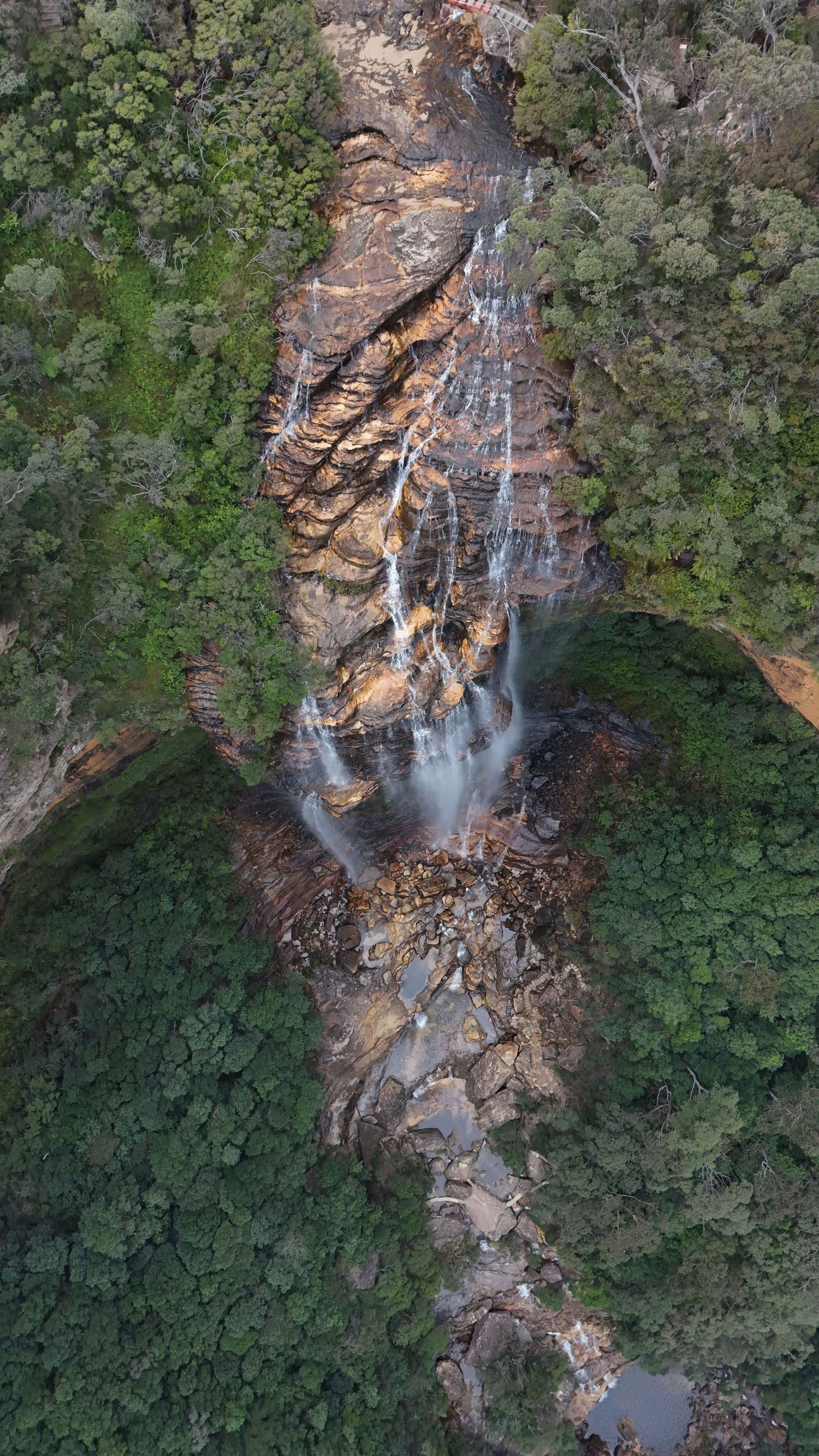 Aerial drone view of a travel destination, dramatic landscape, natural colors, cinematic composition capturing the beauty of the world.