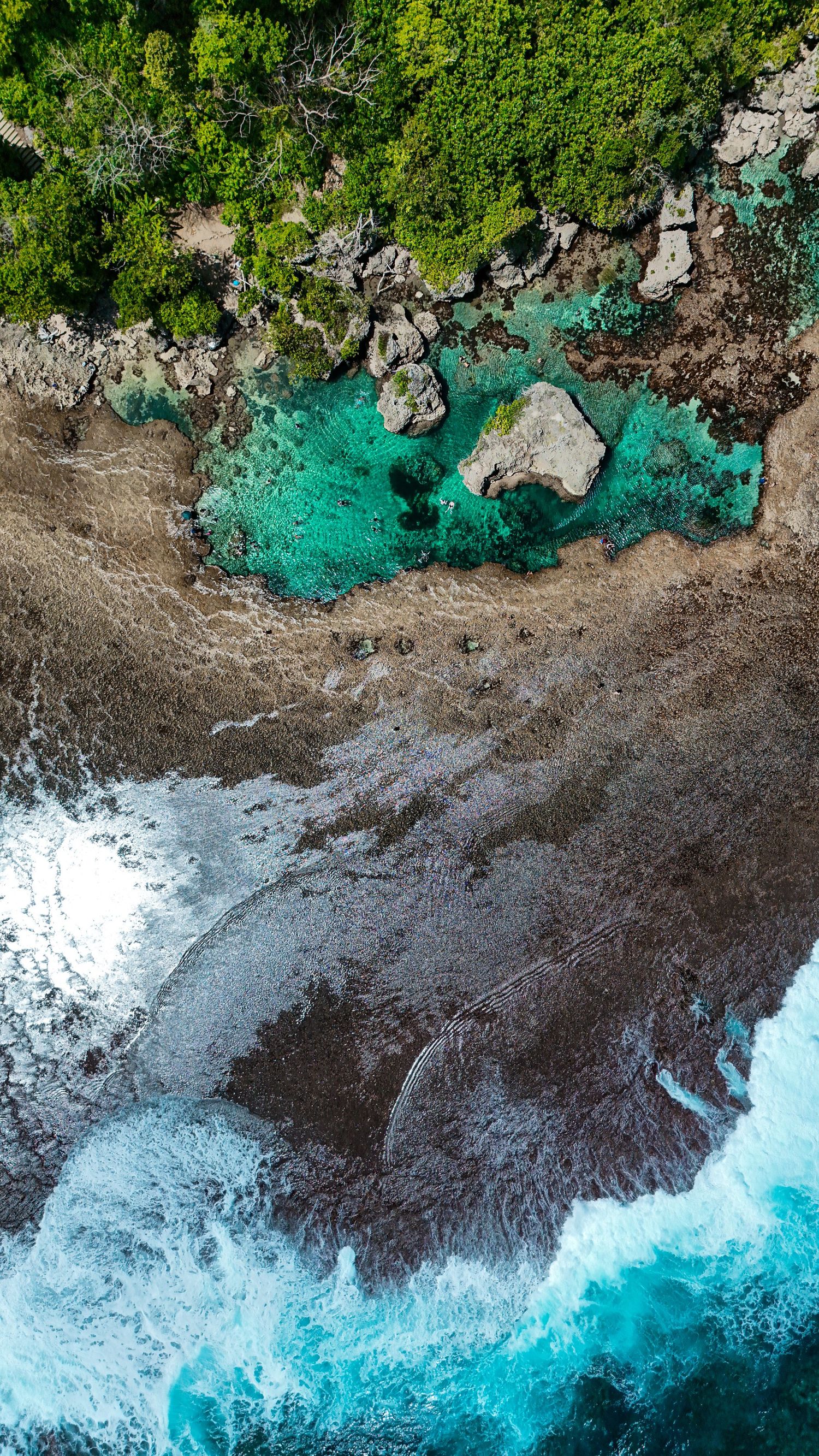 Aerial drone view of a travel destination, dramatic landscape, natural colors, cinematic composition capturing the beauty of the world.