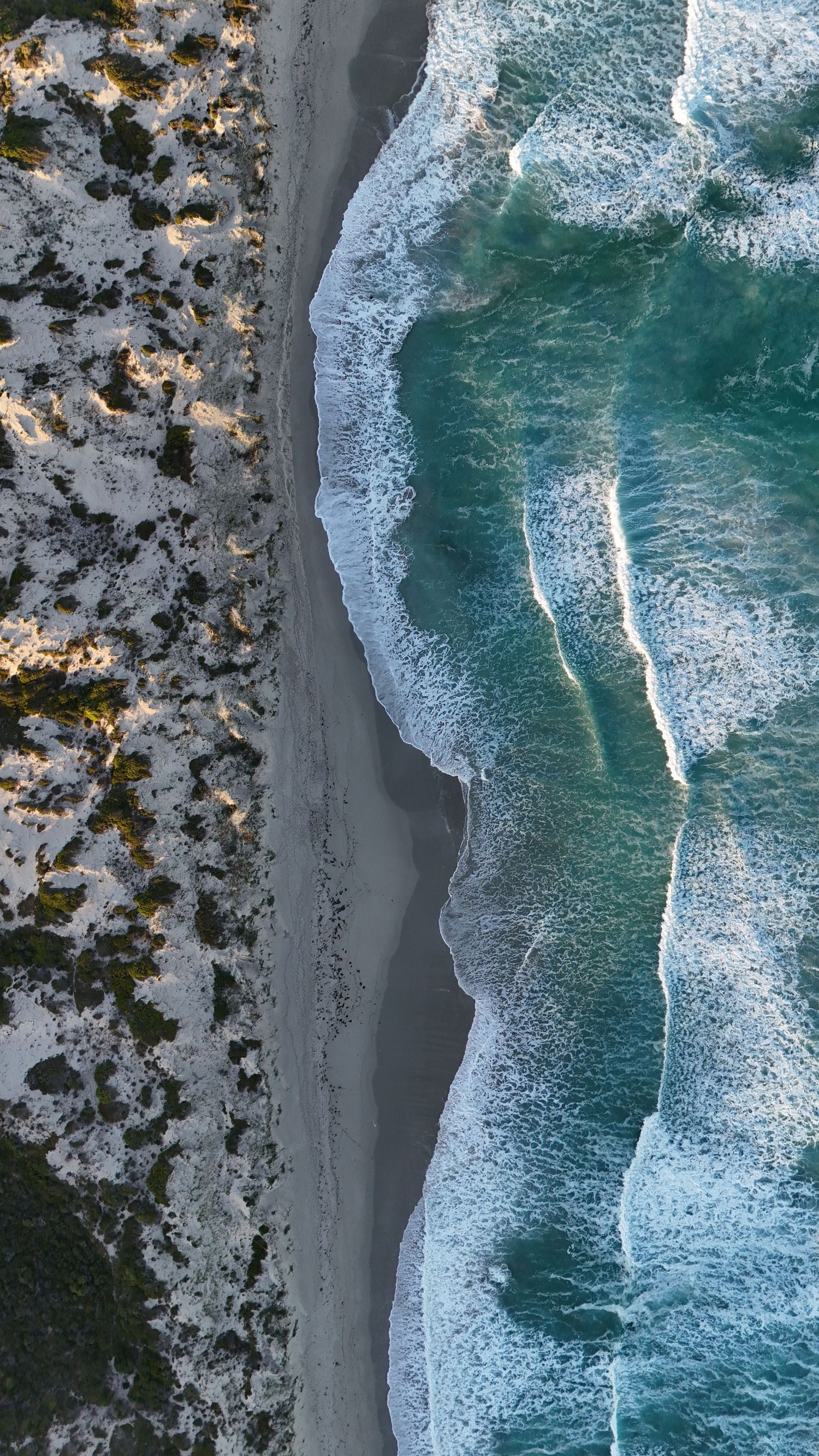 Aerial drone view of a travel destination, dramatic landscape, natural colors, cinematic composition capturing the beauty of the world.