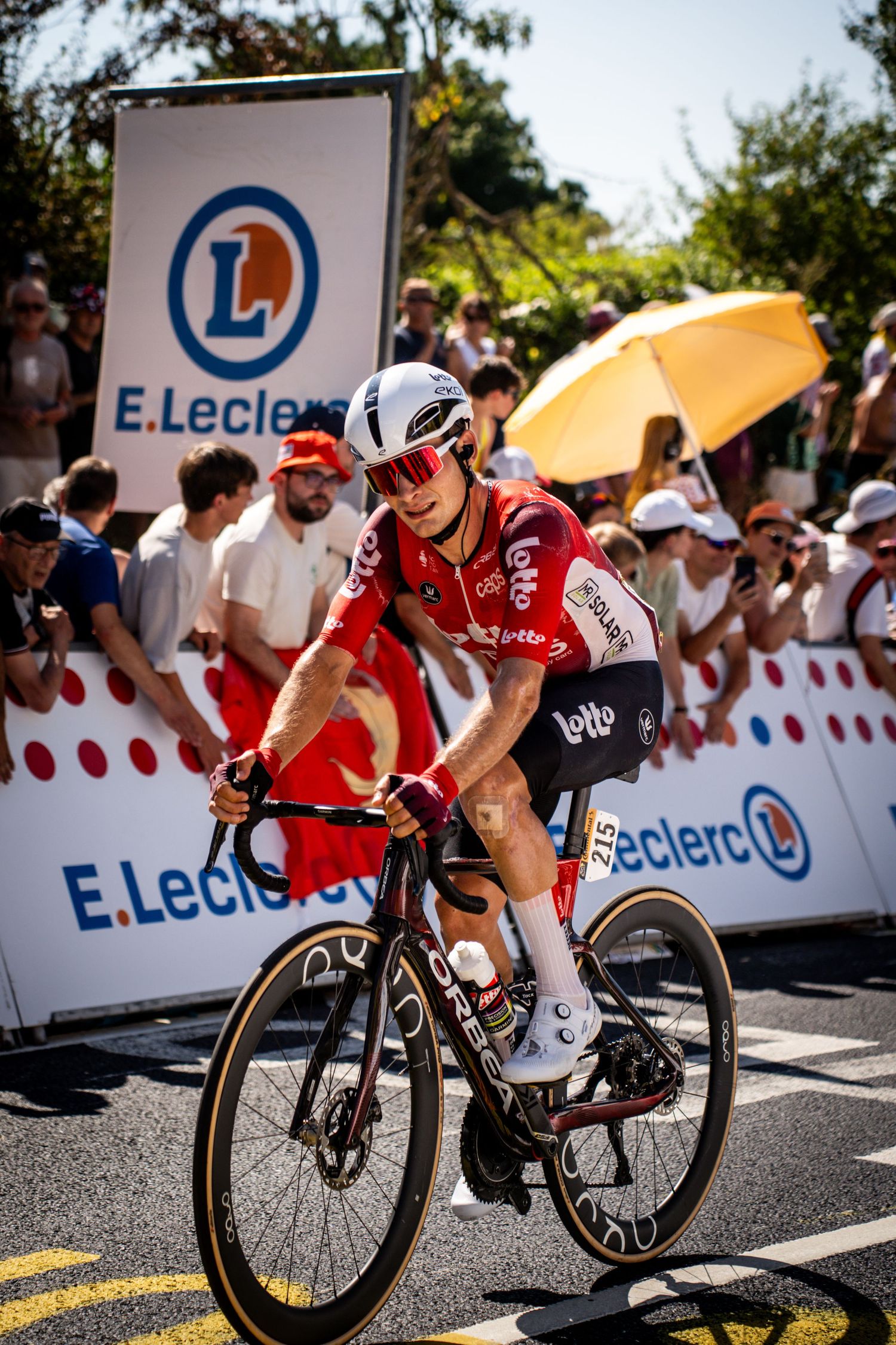 Action photography of cyclists during the Tour de France, motion, energy and determination in a dynamic sports atmosphere.