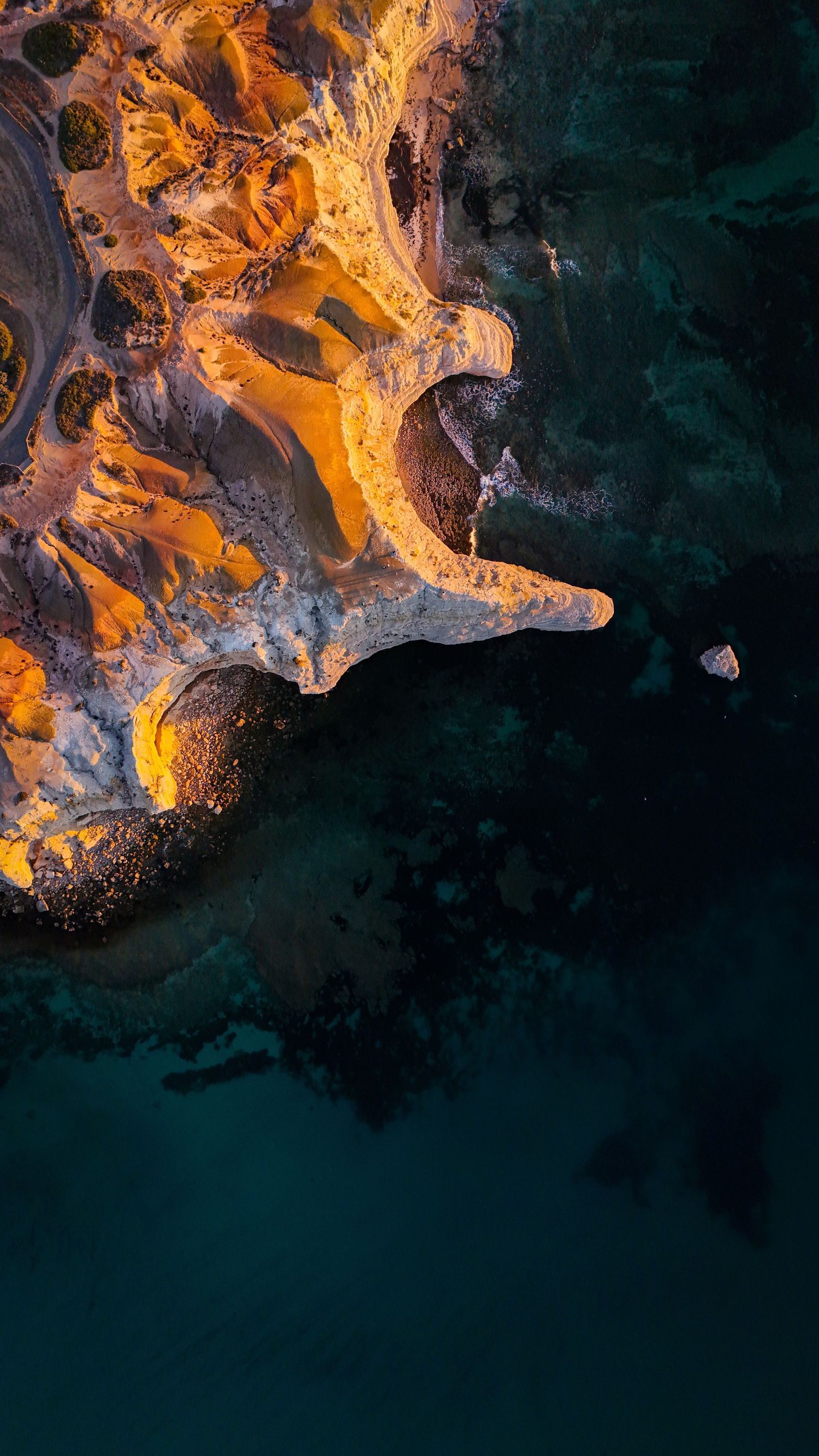 Aerial drone view of a travel destination, dramatic landscape, natural colors, cinematic composition capturing the beauty of the world.