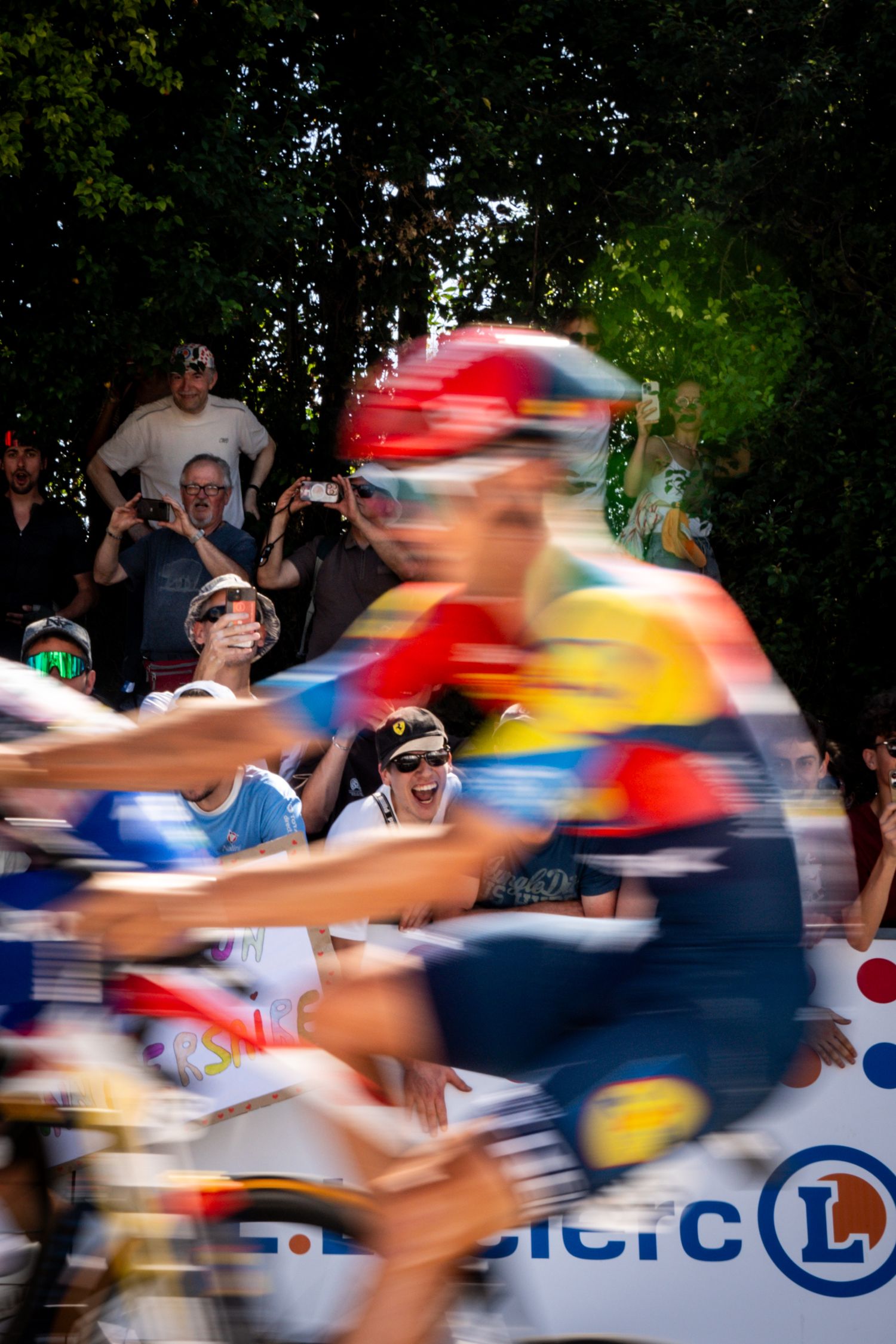 Action photography of cyclists during the Tour de France, motion, energy and determination in a dynamic sports atmosphere.
