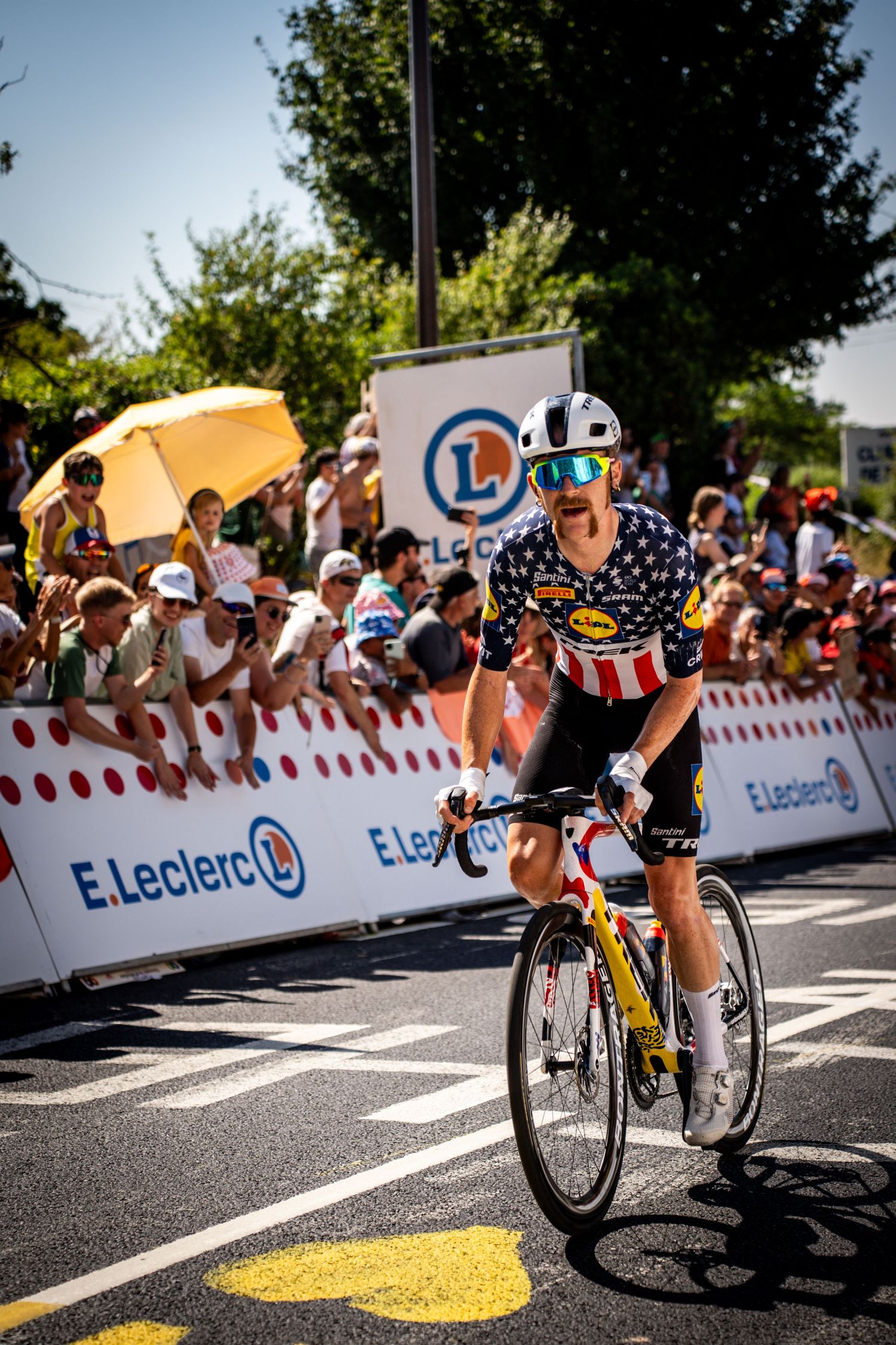 Action photography of cyclists during the Tour de France, motion, energy and determination in a dynamic sports atmosphere.