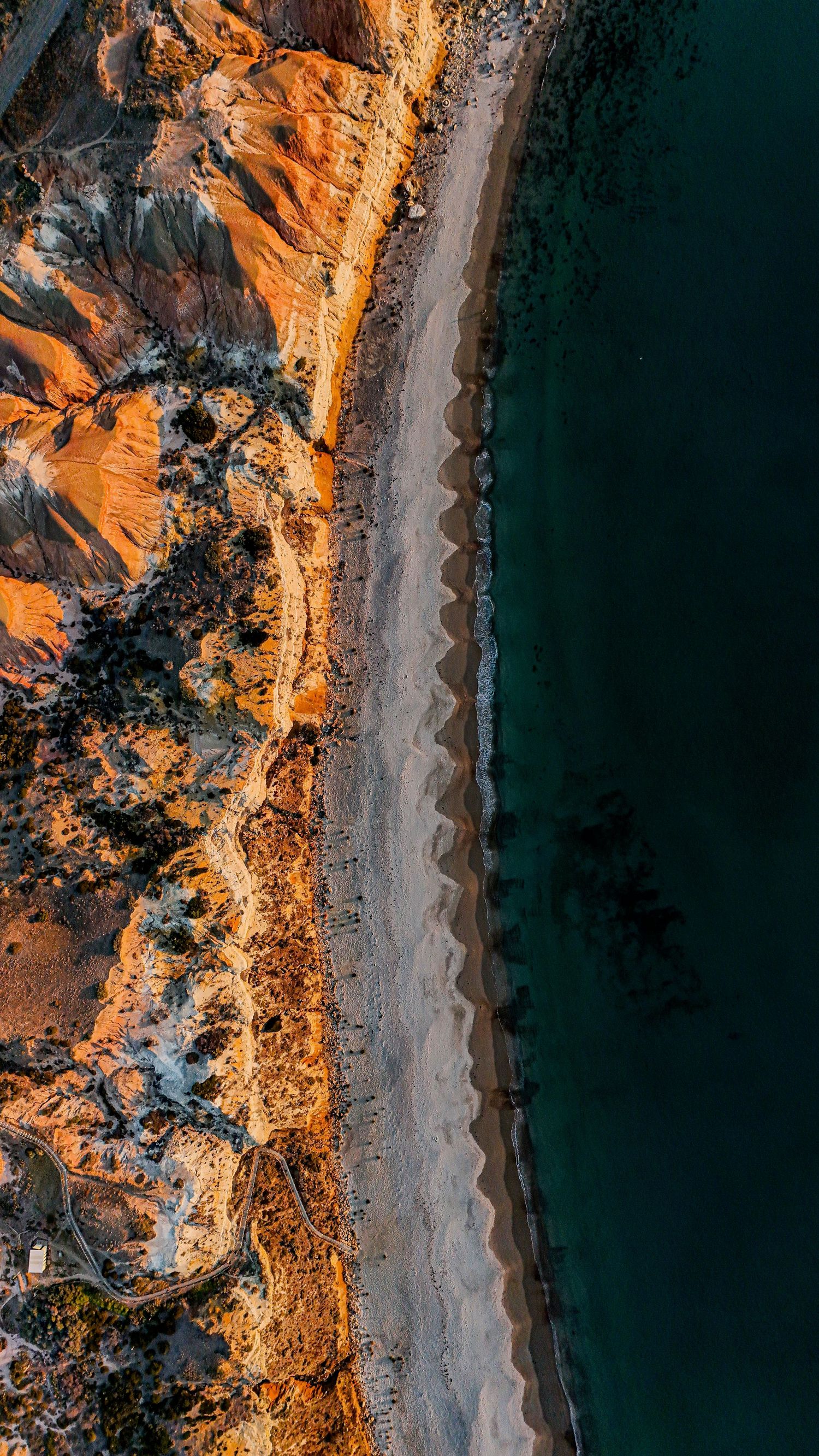 Aerial drone view of a travel destination, dramatic landscape, natural colors, cinematic composition capturing the beauty of the world.